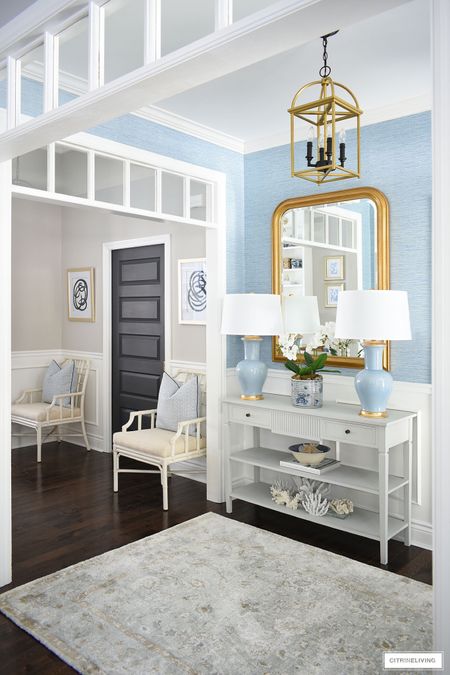 Elegant, sophisticated entryway refresh with our stunning new gold leaf mirror, chic blue lamps and an understated rug with muted tones. Home decor, spring decor, console table, grasscloth wallpaper, entryway decor

#LTKFind #LTKhome #LTKstyletip