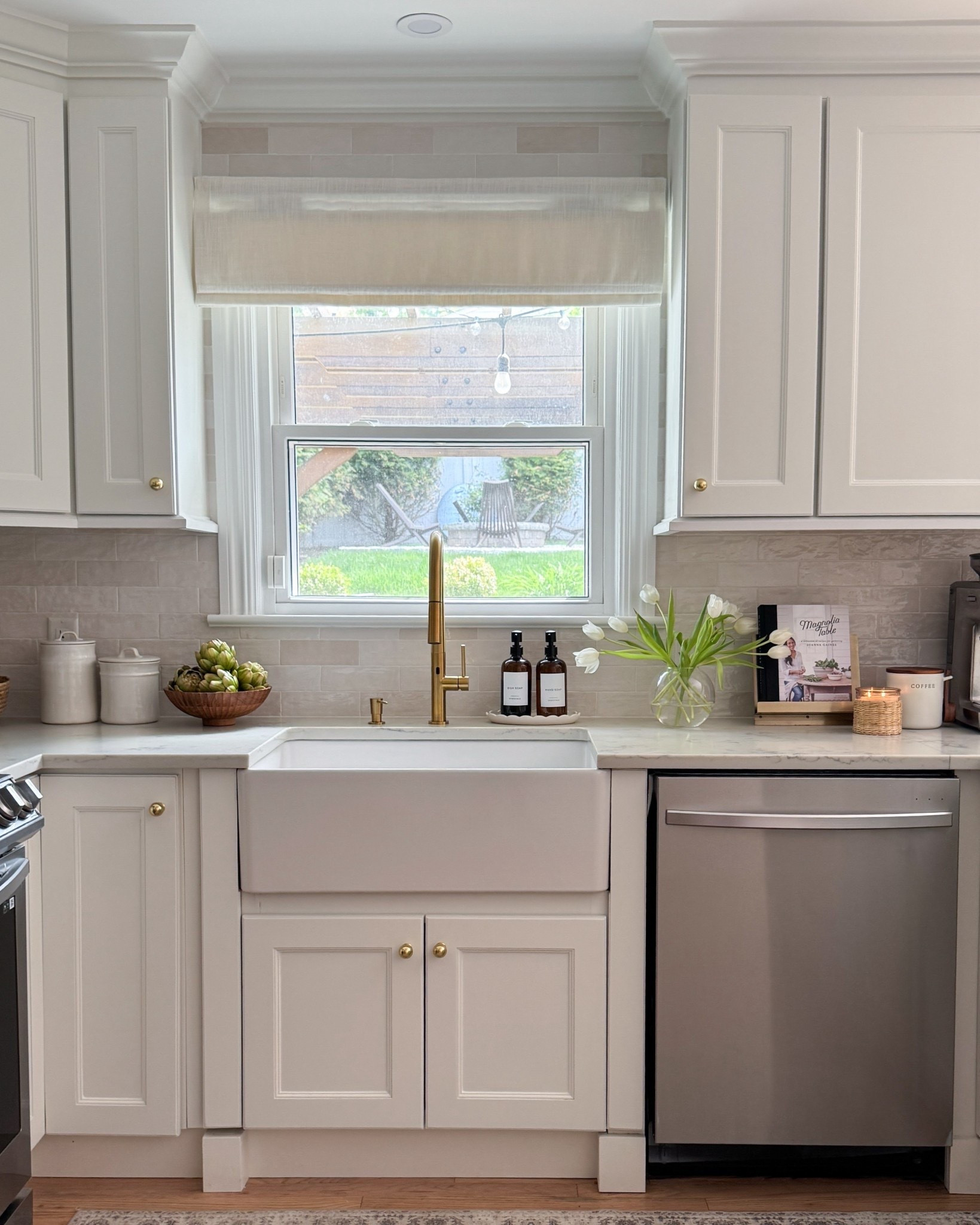 this little sink corner has quietly become one of my favorite spots in our kitchen 🤎✨

there’s something about the mix of classic details, warm tones, and layered textures that makes it feel so calm, cozy, and lived-in. the gold faucet, soft roman shade, and simple styling pieces all work together to give the space that timeless modern organic feel I’m always drawn to. 🌿

it’s proof that even the smallest corners of a home can feel beautiful and intentional with the right details.

#kitchenstyle #modernclassic #neutralhome #goldfaucet #kitcheninspo #LTKkitchen #organicmodernhome

#LTKHome #LTKSaleAlert