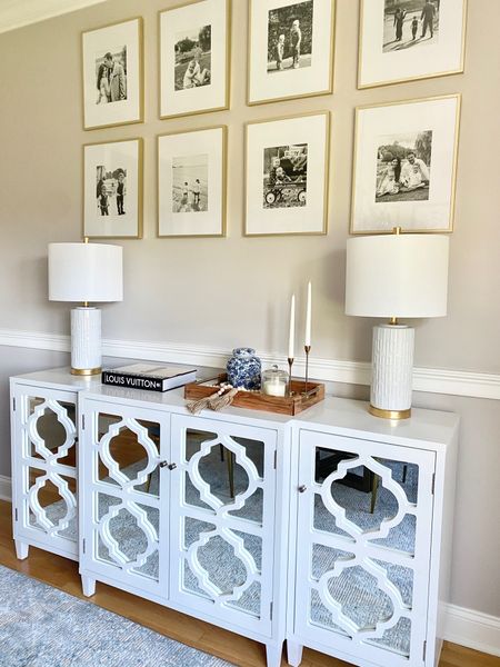 White mirrored cabinet side board, gold frames, lamps 

#LTKhome
