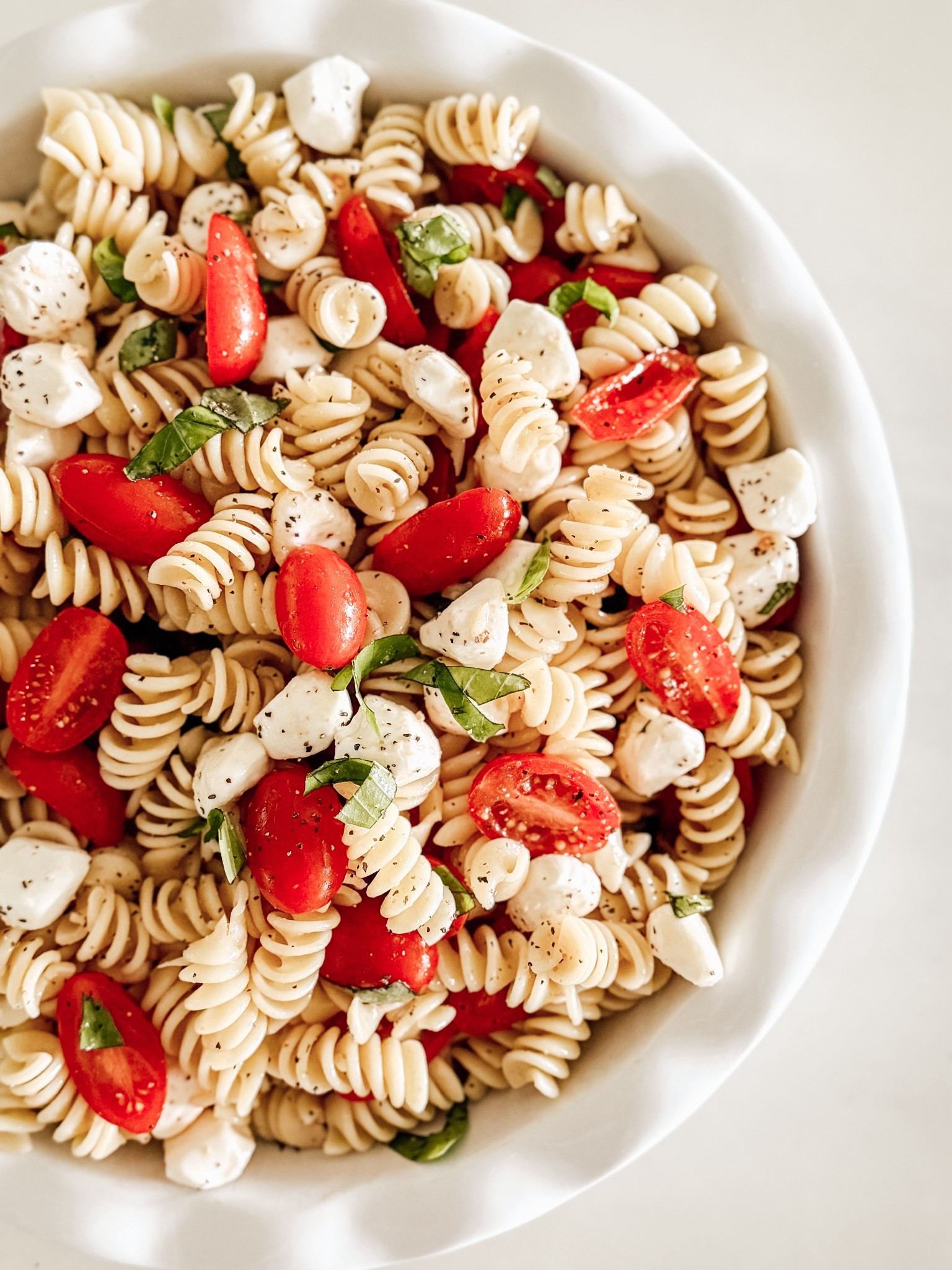 This Easy Caprese Pasta Salad is the perfect Summer Meal! #summermeals #capresesalad #pastarecipe

#LTKHome #LTKSeasonal