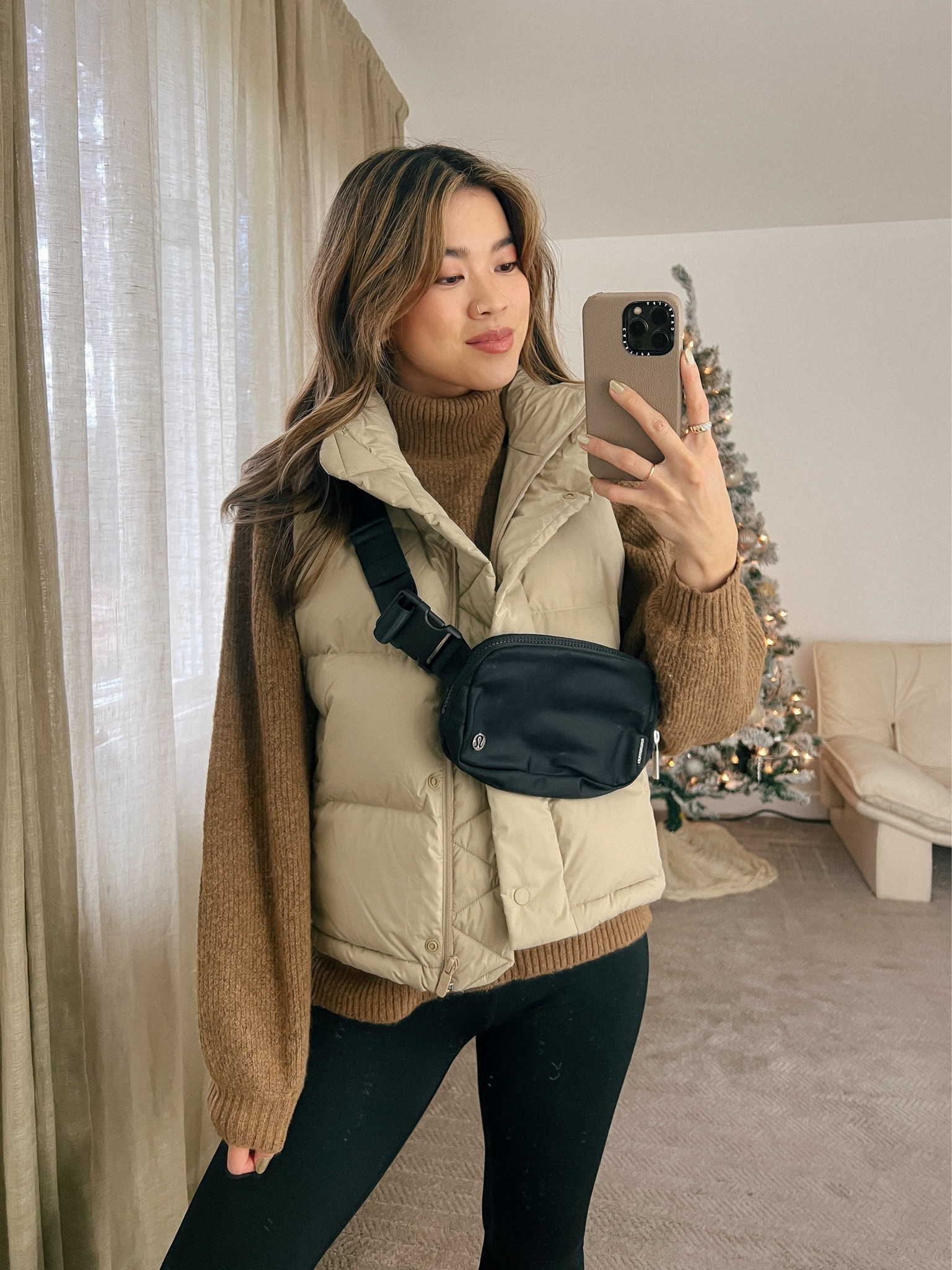 Brown turtleneck sweater layered under the Lululemon Wunder puffer vest with black flare pants and Jenni Kayne shearling-lined clogs!

Top: XXS/XS
Bottoms: 00/0
Shoes: 6

#winter
#winteroutfits
#winterfashion
#winterstyle
#holiday
#giftsforher
#lululemon
#jennikayne
#everlane 
#madewell


#LTKHoliday #LTKSeasonal #LTKstyletip