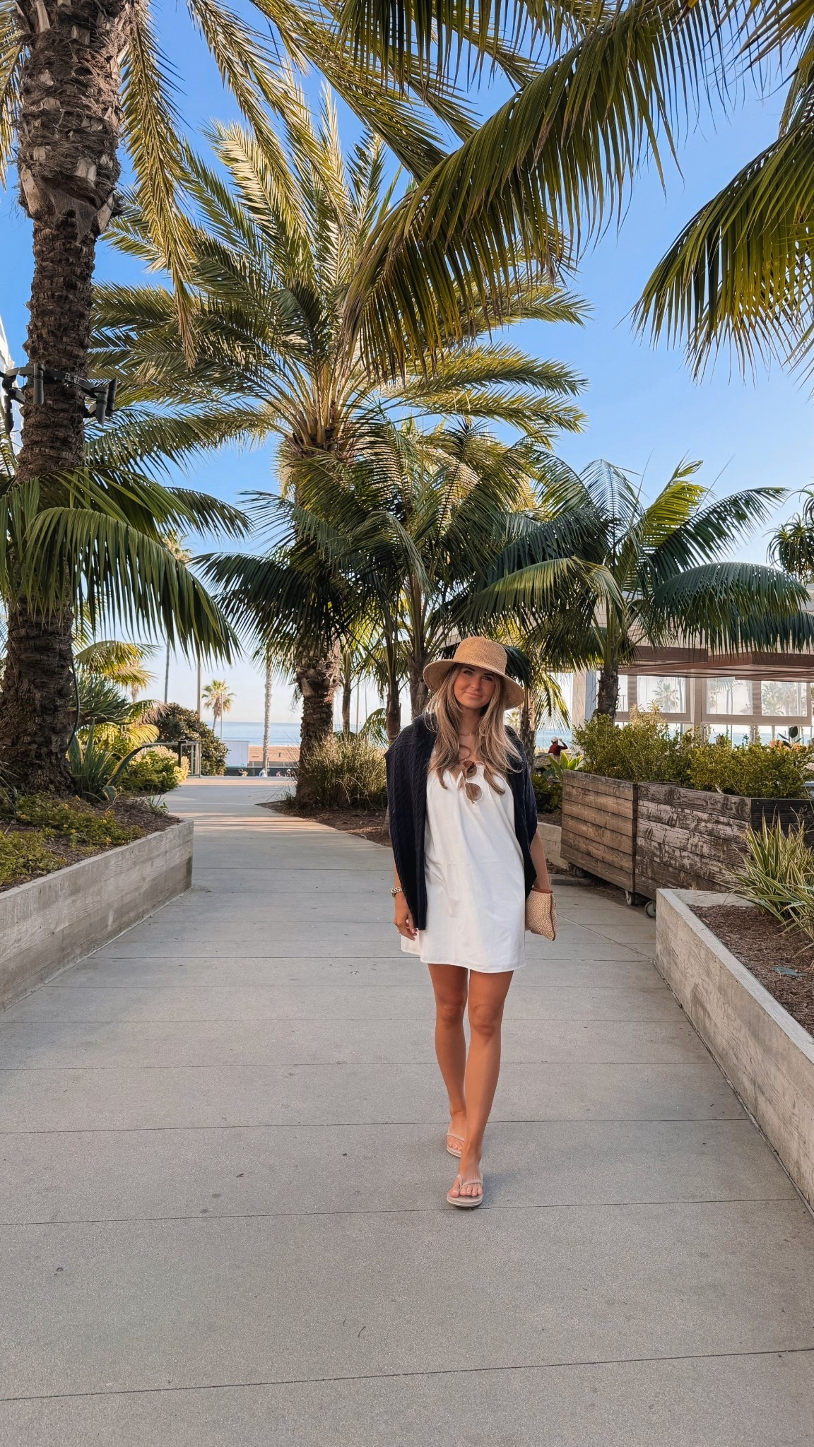 Easy vacation outfit 🤍 This white mini dress is the perfect warm weather staple — lightweight, breezy, and so easy to style. Threw it on with a straw hat, sandals, and a light layer for an effortless beach walk or resort day look. Perfect for summer outfits, beach vacations, travel outfits, and casual everyday wear.

white mini dress, summer dress, vacation outfit, beach outfit, resort wear, travel outfit, casual summer outfit, white dress outfit, warm weather style, everyday dress, summer fashion, comfy sandals, hari mari, revolve resort outfit, amazon sunglasses, spring break style

#LTKTravel #LTKootd #LTKgrwm