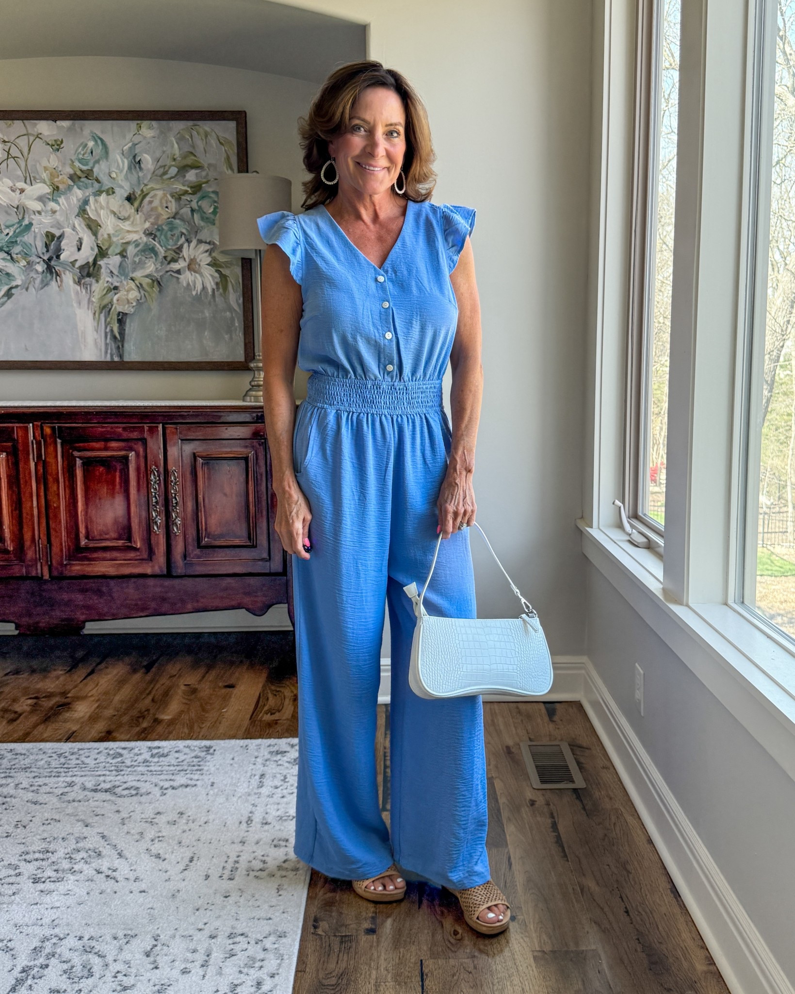 Blue wide leg jumpsuit with flutter sleeves and sandals

This is one of those one-and-done outfits that makes getting dressed easy. Flowy, comfortable, and still looks like you put in effort.

#jumpsuitstyle #over50style #effortlessoutfits #amazonfashion