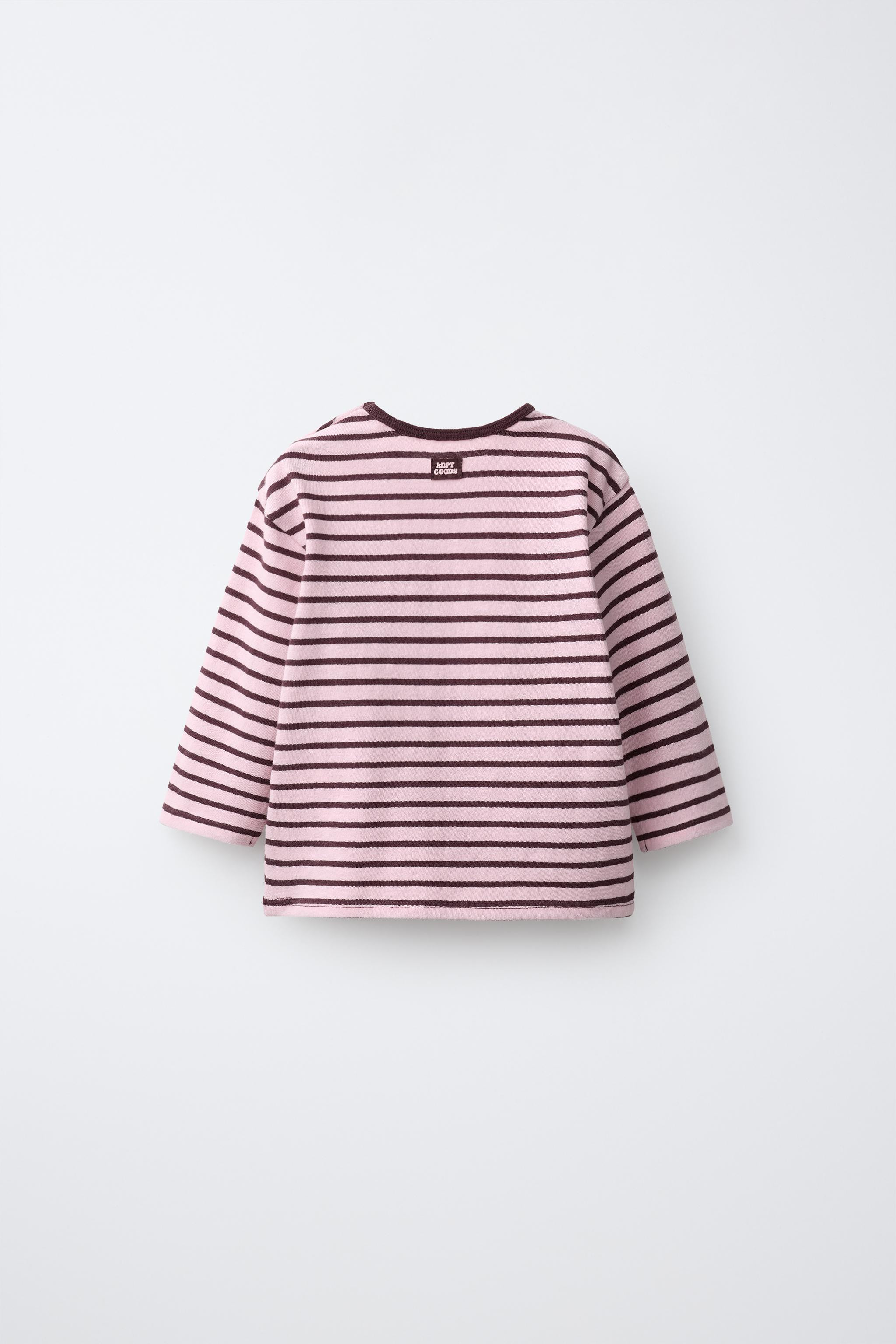 Round neck long sleeve T-shirt. Snap button closure and label appliqu\u00e9 at the back. Striped ... | Zara US