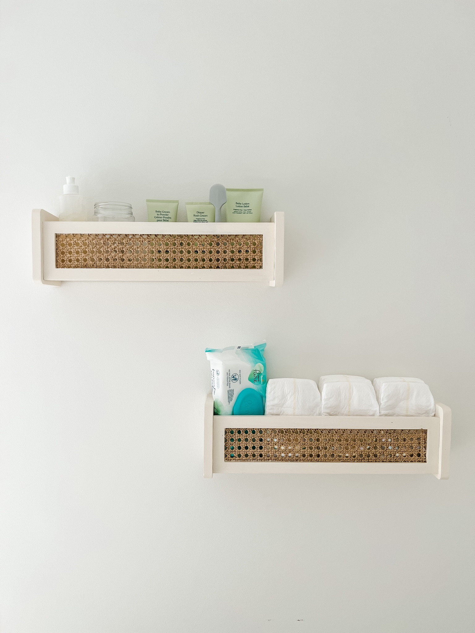 Exciting transformation happening in our guest room!!

I've always used drawers under the changing pad to store diapering essentials, but planning to change it up with these storage shelves that can be used later on for books, trinkets, or whatever the boys find on their adventures. Can you believe these amazon shelves were just over $25 for the set? Talk about a look for less!! A little sanding, stain, and paint and they match perfectly with our timeless antique furniture and decor in the room. I have all of our must-haves in one place (and out of reach for our toddler.. lesson learned 🙃) and get more storage space in the drawers for our non-hanging clothes!

For the shelves: I first sanded the cane webbing to remove some of the coating and expose some of the cane below, so the stain would penetrate deeper in places and give the antique look I wanted. I then mixed about 1/4 cup of clear poly, 4 tbs of weathered oak stain, and 1 tbs of special walnut stain and added/dried layers until they matched a rattan tray we have (about 8 layers total). I assembled all except the front cane pieces, covered both sides of the cane with foil, and sprayed the wood with a french cream spray paint. Once dry, I added the fronts and mounted them using the included level and screws and a screwdriver. It also comes with drywall anchors if they're going to be holding heavier items or used by clumsy kiddos 😊

I also stained a cane picture frame with the same stain mixture, can't wait to show you!

amazon dupe diy antique cane storage shelves | pipette nontoxic baby diaper rash cream | pipette all natural talc-free cream to powder | pipette baby balm mess-free stick | fridababy windi gas passers | vaseline for windi and circumcision care (we actually keep it in a peri bottle so it's easier to squeeze out and less risk of contamination!) | clear plastic mason jars with lids for storage | pampers swaddlers diapers | pampers pure baby wipes

#LTKbaby #LTKfamily #LTKhome