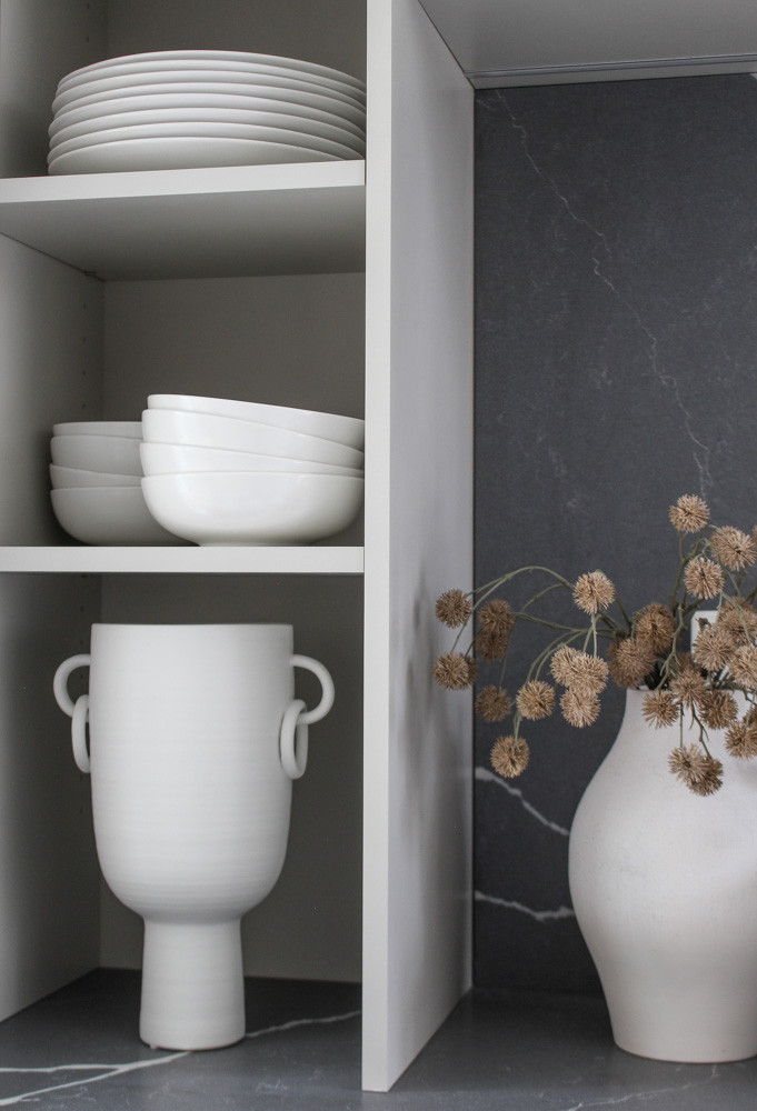 Neutral yet beautiful shelf styling with all white dishes and accessories. Love this accent vase! 

 #LTKHome #LTKStyleTip