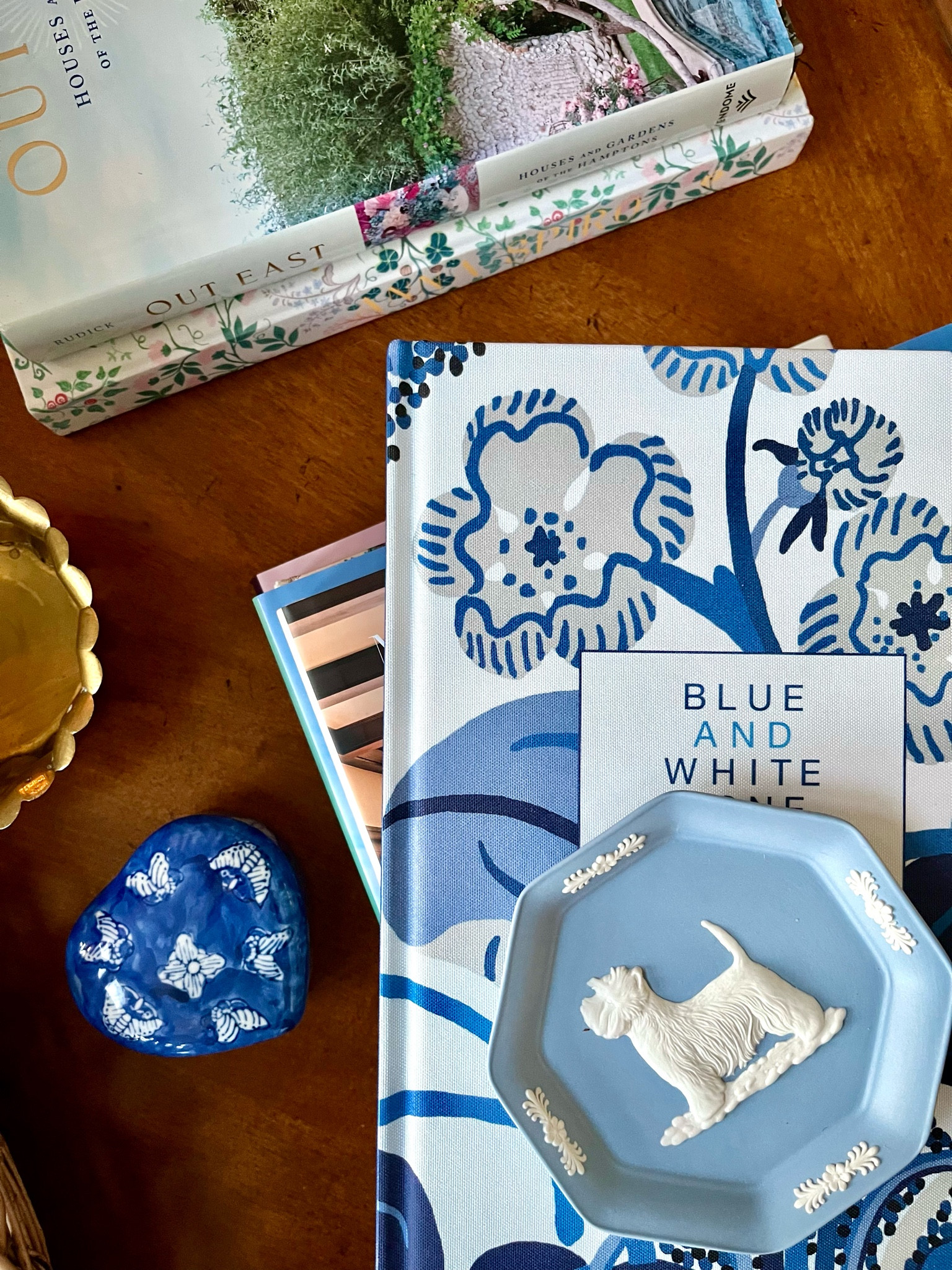 Design books with great covers.. love this Blue and White Done Right on the top of the coffee table stack. And there are gorgeous Hamptons house views via Out East. Both worthy of adding to your design library. Heart shaped blue and white trinket dish would be a perfect gift for upcoming Valentine’s Day - with or without a treasure inside. Haven’t found another Wedgwood Westie dish yet but there is a matching clock! Plus a vintage Year of the Dog dish perfect for the chinoiserie lover and a guide dog Wedgwood featuring a lab...

#LTKhome #LTKstyletip #LTKSeasonal