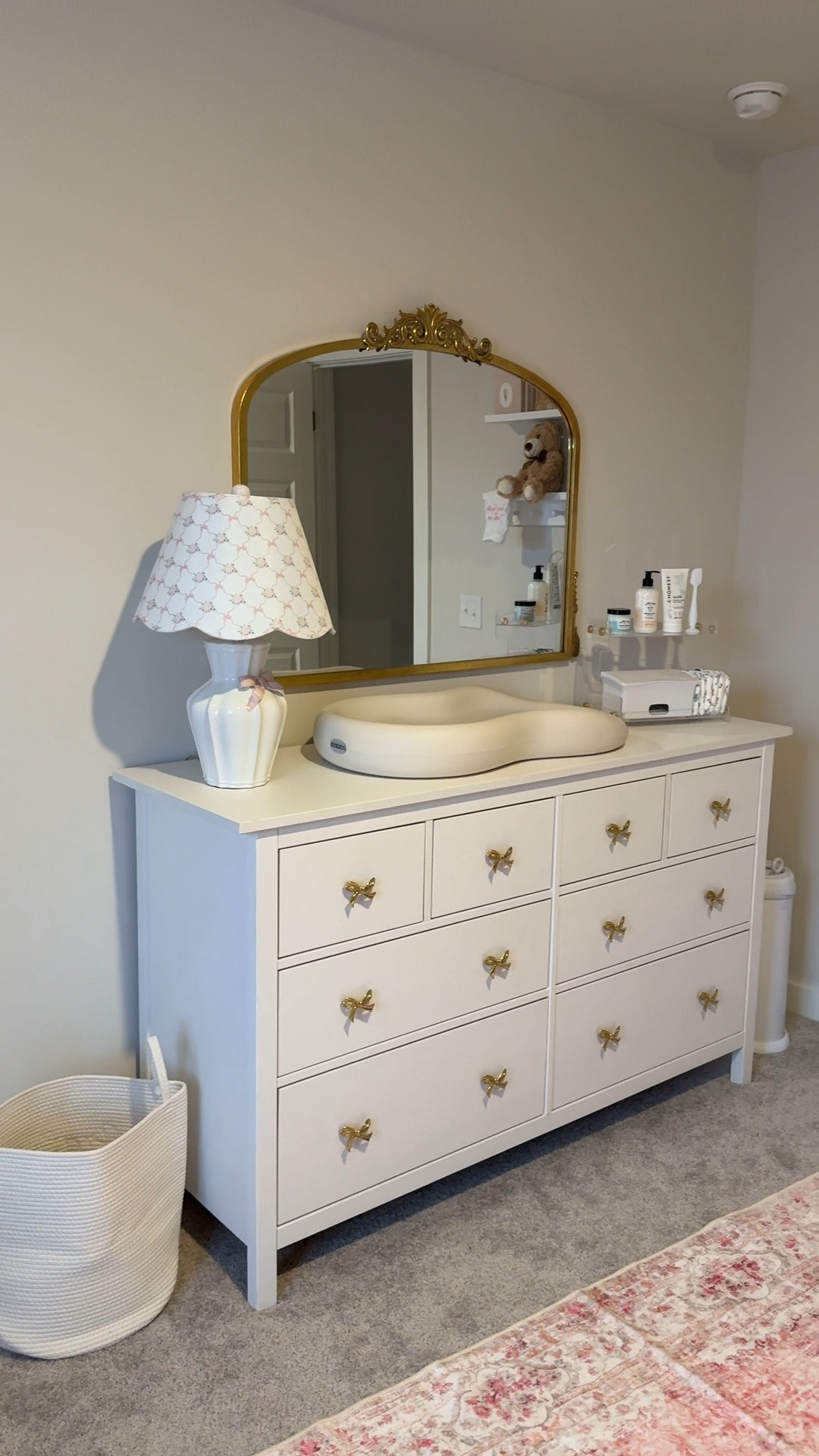 the laundry basket has her name embroidered…but we’re not telling anyone the name till she gets here🎀 but i loveee how it turned out🤩 #nesting #girlmom #firsttimemom #2025mom #nurseryinspo #nurserydresser #changingtable #diapering 