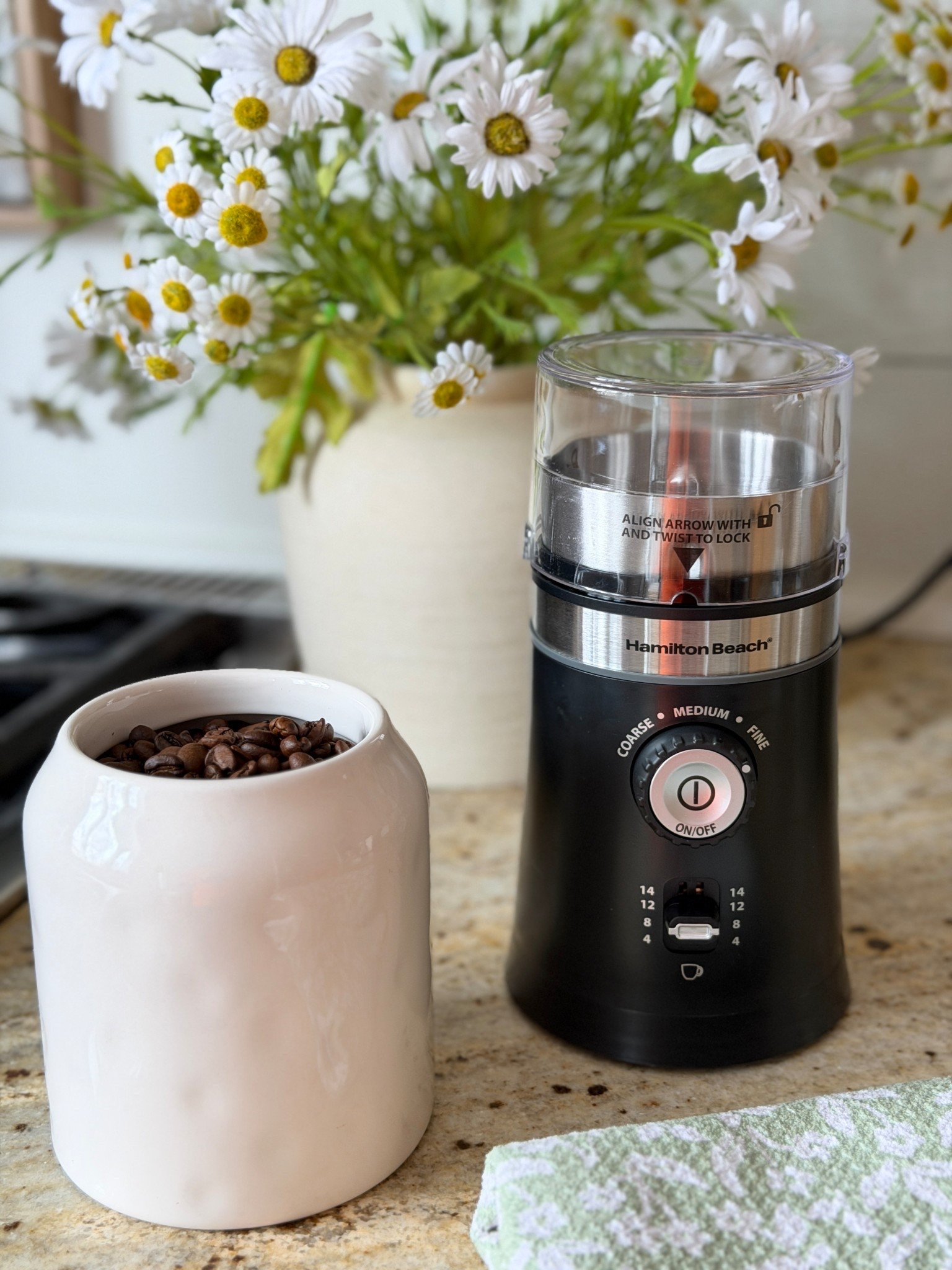 Enjoy the taste of freshly ground coffee every morning with the Hamilton Beach Custom Grind Electric Coffee Grinder. This hands-free appliance automatically grinds your beans after a single button press and shuts off when finished. Easily customize your brew by selecting from five adjustable grind settings, ranging from coarse to fine. You can choose to grind enough for just 4 cups or a full pot up to 14 cups, making it perfect for any occasion. The durable stainless steel blades efficiently handle coffee beans, herbs, and spices

#LTKHome #LTKSeasonal #LTKmorningroutine