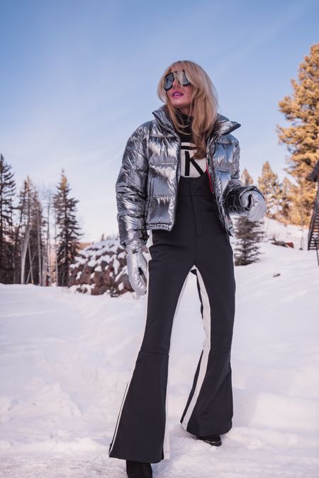My ski #ootd featuring the coolest pieces from @saks! #SaksPartner #Saks

When it comes to skiing, there’s a few different options for what to wear. I prefer a ski suit or overalls. For my ski outfit today, I paired a really chic metallic puffer by Perfect Moment with silver Goldbergh mittens, which are both very on trend, with some chic black Perfect Moment ski overalls. I love the racing stripe down the sides… not only is it cool, it’s also really flattering. I finished the look with some ultra cool Loewe aviator sunglasses that I LOVE! 

Fits are true to size.

~Erin xo 

#LTKSeasonal #LTKfitness
