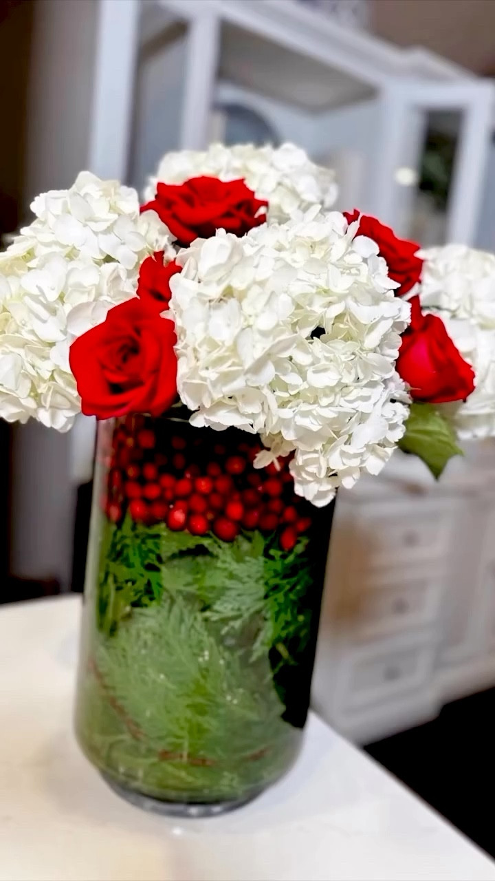 Elegant Holiday Floral Arrangement celebrates the season with a simple yet striking festive-themed floral centerpiece! ❤️ Embrace the holiday spirit and create your own masterpiece!

I added some real touch florals if guys like to recreate without using water and fresh florals for a longer lasting arrangement. 

Love this for a Christmas wedding centerpiece, holiday hostess gift or for your Christmas tablescape.  



#LTKHome #LTKHoliday #LTKSeasonal