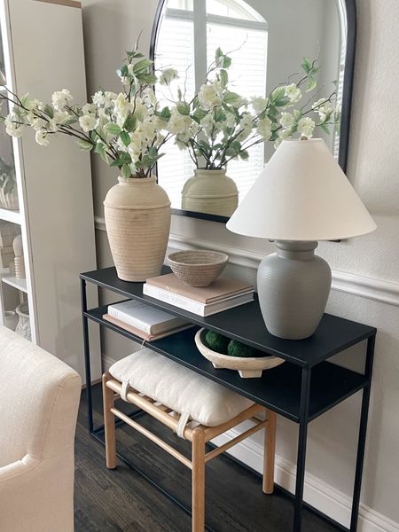 Simple console table styling with Walmart, Target and Amazon home decor finds. 

Our everyday home, table lamp, arch mirror, faux stems, ottoman 

#LTKfindsunder50 #LTKhome #LTKfindsunder100