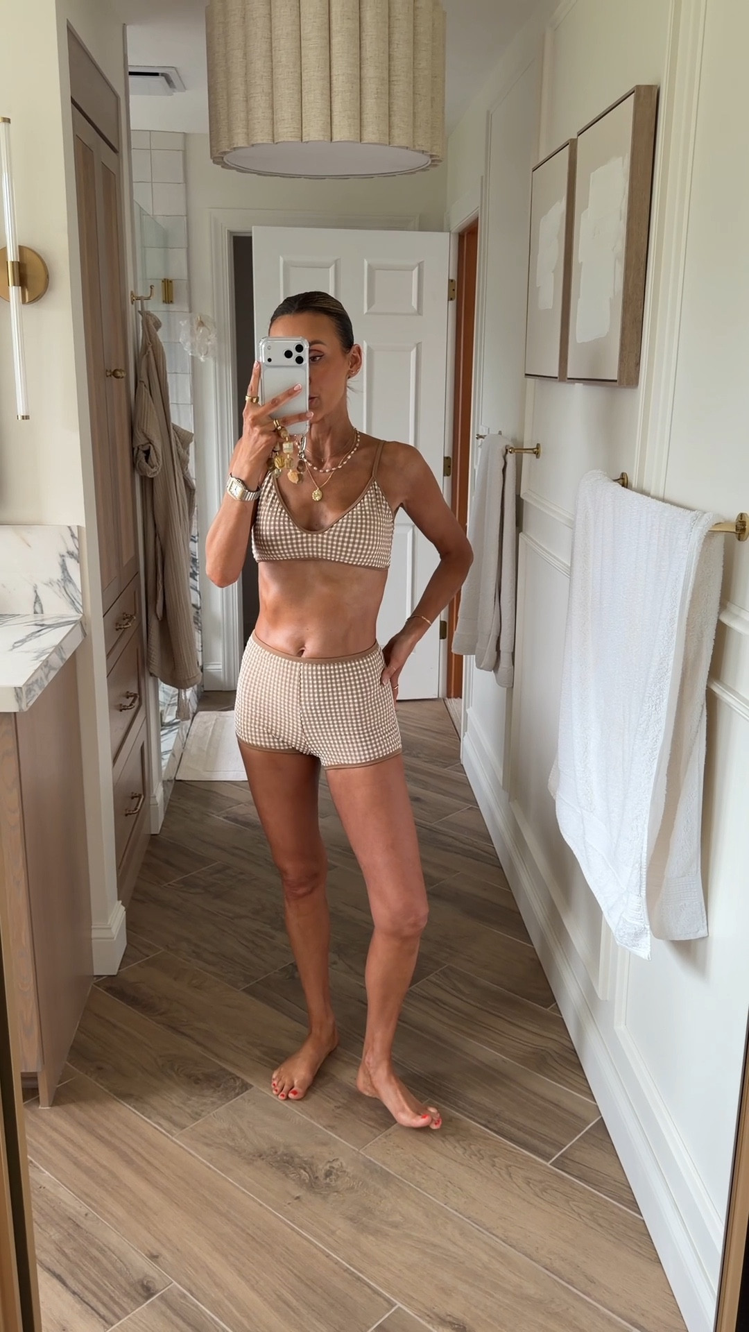 Loving this boy short bathing suit style in gingham- size small. Linking the matching sjirt I got to wear together 

#LTKSwim #LTKOver40 #LTKSeasonal