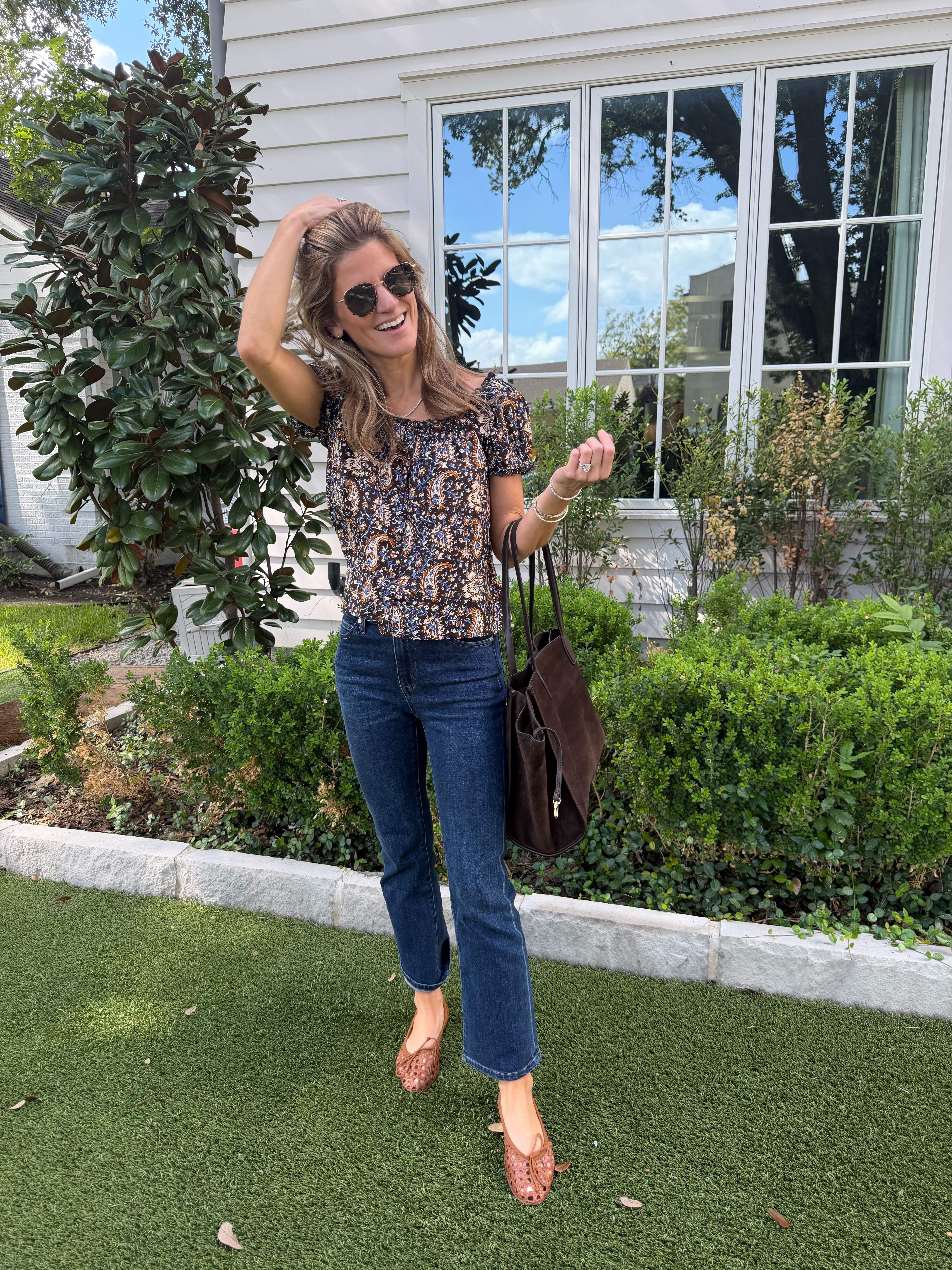 Madewell paisley puff sleeve top · wearing XS.

Quince kick flare jeans · true to size. Dark wash with a cropped kick flare.

Margaux woven ballet flats · I also linked the Target version, and they look almost exactly the same for way less!

Madewell brown suede tote

Fall outfit · mom outfit · school drop off outfit · kick flare jeans · dark wash jeans · paisley top · puff sleeve top · woven flats · ballet flats · suede tote · Target finds · elevated casual 

 