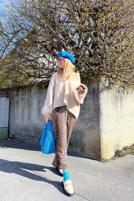 Leopard Blue. Fashion Blogger Girl by Style Blog Heartfelt Hunt. Girl with blond hair wearing leopard print pants, blue beret, slim sunglasses, chunky sweater, blue statement bag, blue socks and chunky loafers. #colorfuloutfit #colorfulstyle #colorfulfashion #colorfullooks #fashionfun #cutespringoutfit #springfashion2023 #springlookbook #fitcheck #dailylooks #dailylookbook #contentcreator #microinfluencer #discoverunder20k 