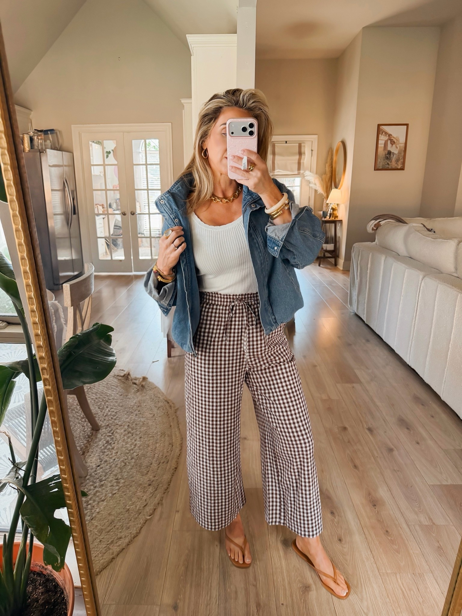 August is always a challenging time for getting dressed. You want to move ahead to fall, but it’s just too hot. I love an easy layer I can put on and take off when I need to like this denim bomber jacket.

Fall outfits over 40, denim jacket, gingham pants, white tank top, sandals, summer outfits over 40, weekend outfits

#LTKgrwm #LTKmomlife #LTKOver40
