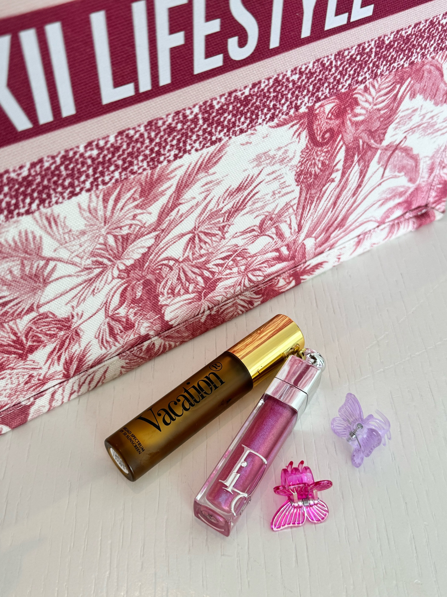 Summer essentials: a spritz of 'Vacation' for that tropical vibe, a swipe of Dior gloss for a perfect pout, Vacation Chardonnay Lip Oil for SPF, and these cute butterfly clips for a touch of whimsy. 🦋 #SummerStyle #BeautyFavorites 

#LTKSwim #LTKStyleTip #LTKBeauty