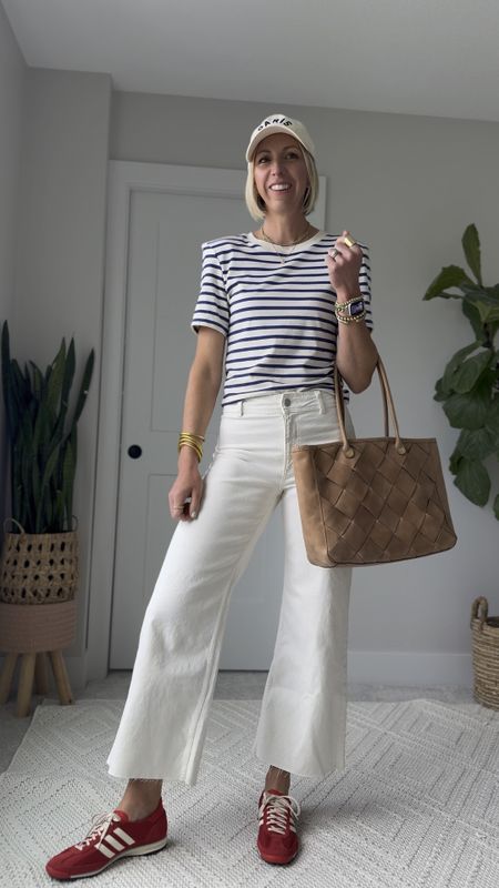 This outfit is the perfect mix of casual and polished! 
The striped tee is classic, plus brings a pop of print, the cropped white jeans are modern & elegant. The red sneakers, a fun punch of color  & playful style. 

I did size up one size in these white jeans, they run a little snug, and I prefer my jeans to have a relaxed fit for the most flattering look. 

#LTKFindsUnder100 #LTKVideo #LTKOver40