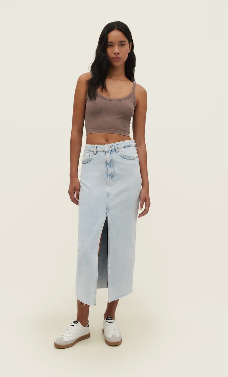 Long straight fit denim skirt with a front slit and seamless hem. Featuring a high waist, comfort... | Stradivarius (UK)