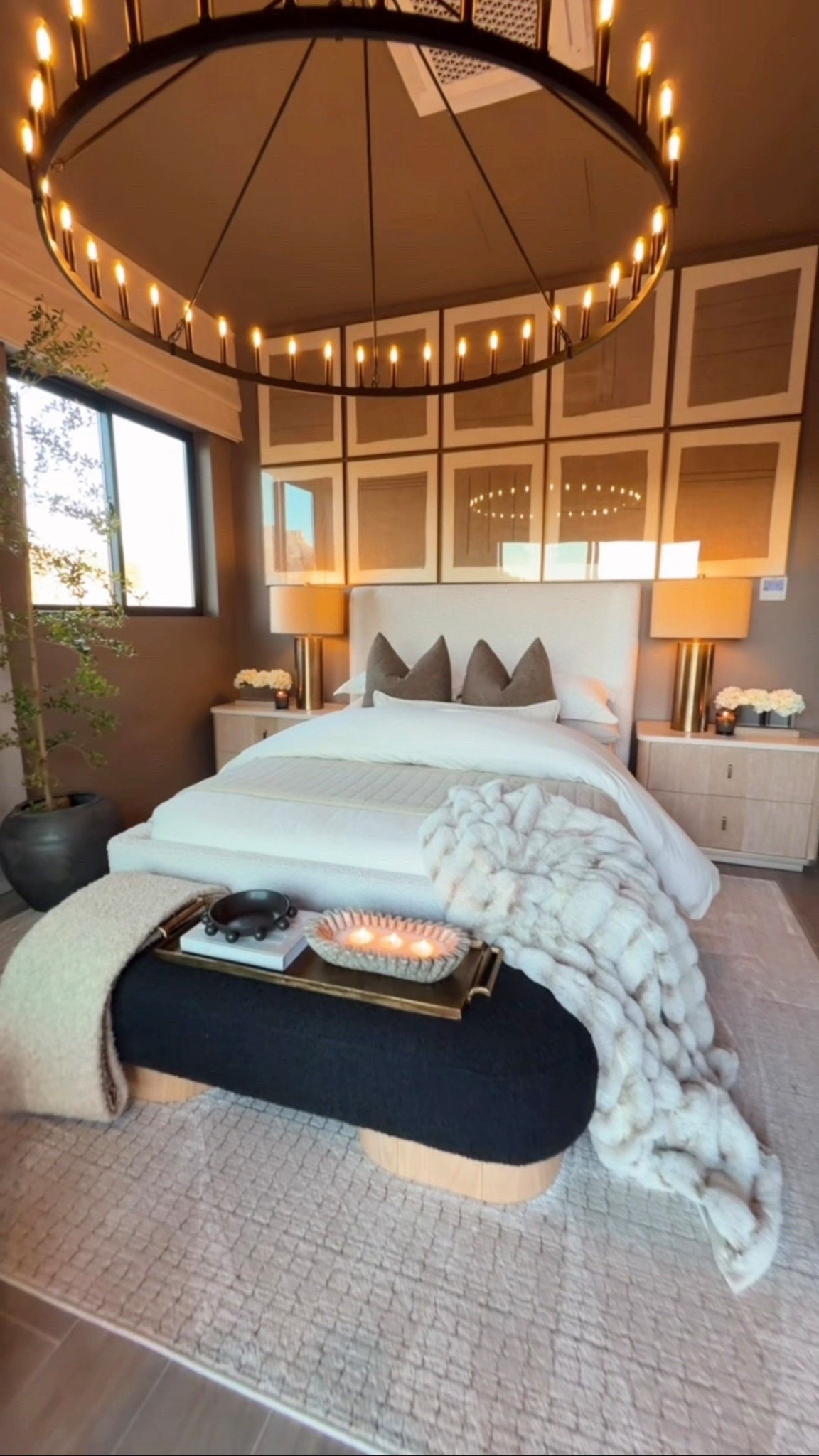 RH Inspired Bedroom 👏

Soft, airy layers bring a fresh RH-inspired bedroom to life with light spring home decor touches. A stonewashed quilt, styled decor books, and a lumbar pillow create relaxed texture, while the clay bench, wagon wheel chandelier, and neutral rug add warmth and timeless character. Finished with a realistic faux tree, this look is perfect for neutral bedroom styling and elevated luxury home decor with soft spring vibes. 🌿✨