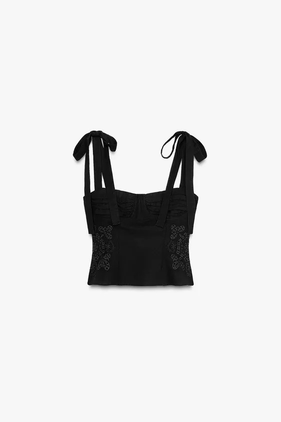 Top made with 14% linen. Straight neckline and tie straps. Matching embroidery detail. Metal zip ... | Zara UK