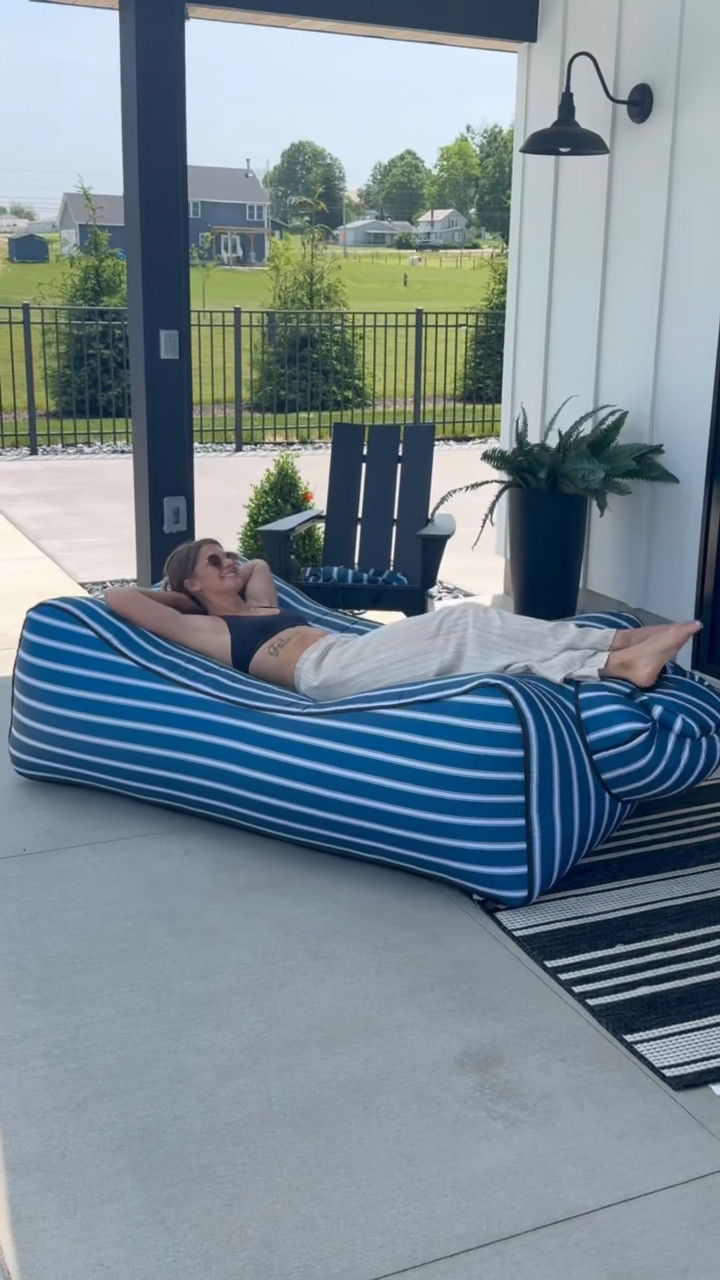 I didn’t think I needed this and now I want to s hout from the rooftops about it because it’s that good 😂 We usually lounge in our backyard anyway, but this thing changes the lounge game. This inflatable couch is blown up from outdoor air and sets up in 1 minute. We are going camping this weekend and I told my SIL I’m taking this instead of an air mattress because it’ll save me so much time 🤣 No pump, no effort, just a quick swoop, roll and buckle! Perfect for camping, the beach, and we even use it in our pool as a float because it’s waterproof!  It folds up super small into this carrying bag making it perfect to throw in your carry-on luggage or beach bag! My kids are all over this thing and always want a turn but I’m not sure I’ll ever get off it🤣☀️ 

#LTKSeasonal #LTKSummerEdit #LTKHome
