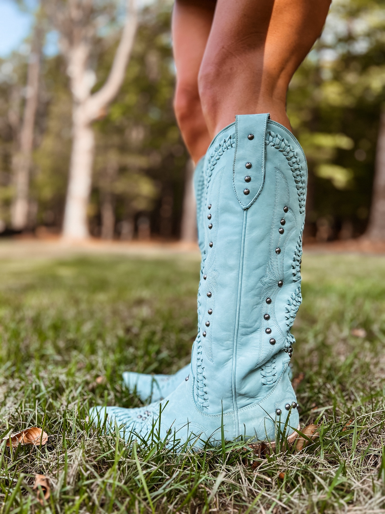 LANE BOOTS: COSSETTE - powder blue 🩵 The supple, full grain leather lends itself perfectly to the intricate double helix of braiding that is sure to complete any look from casual to evening. They come in several other color such as: black, red, turquoise, brown, pink, grey + more!

Details:
Shaft Height: 15"
Heel Height: 2"
Calf Circumference: 16"
Ankle Circumference: 13"
Toe Shape: Snip
Signature Turquoise Soles


#LTKSeasonal #LTKU #LTKShoeCrush