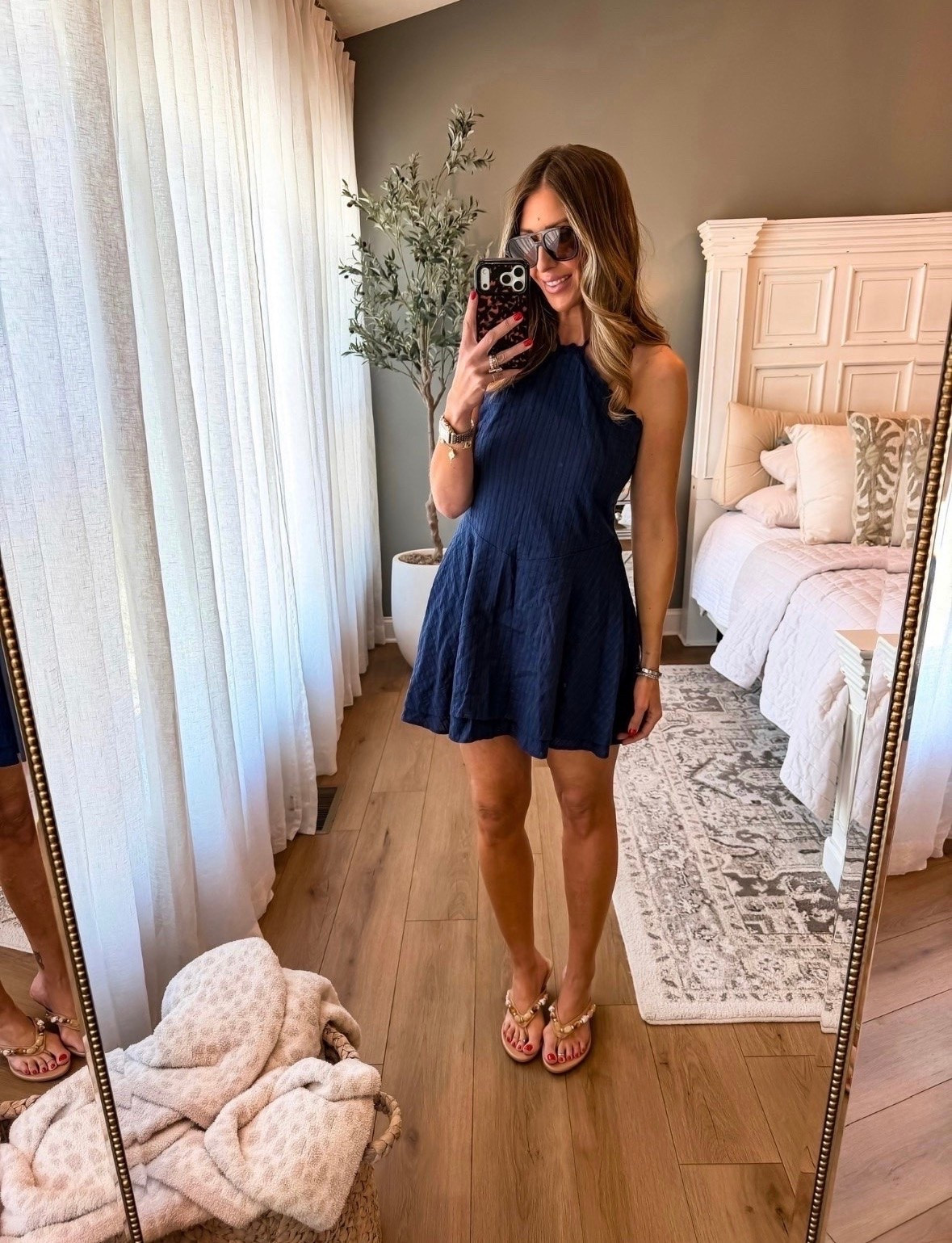 This navy mini dress is one of those easy throw on pieces that always looks polished. The textured fabric and halter neckline make it feel elevated, while the relaxed fit keeps it comfortable for summer dinners, vacations, and everything in between. Paired it with gold sandals and oversized sunnies for an effortless warm weather look. ☀️

navy dress, summer dress, vacation outfit, date night outfit, resort wear, halter dress, beach vacation style, summer fashion, casual chic outfit, dinner outfit, elevated basics, warm weather style, themominstyle

#LTKootd #LTKSeasonal #LTKdayinmylife