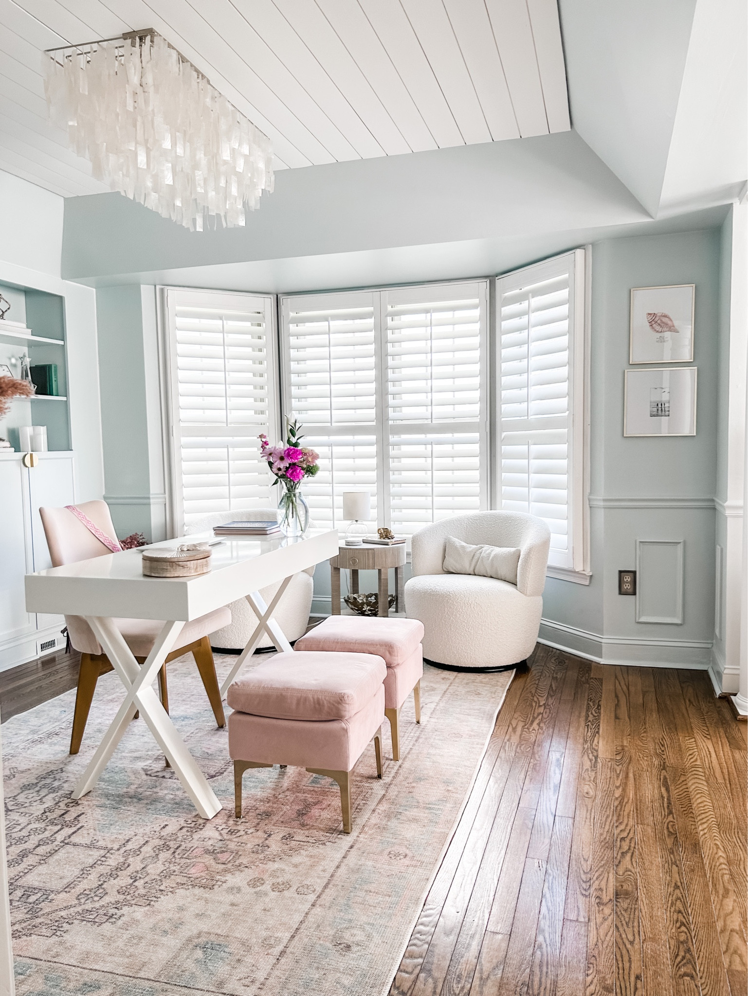 Added two thin metal gold picture frames, one square picture frame and one rectangular picture frame to my home office wall with coastal art prints from Lindsay Letters!

Home office decor, upholstered velvet ottoman with gold metal legs, white writing desk, capiz shell chandelier, coastal chandelier, capiz light fixture, wall art, area rug, transitional area rug, blush area rug, desk decor, swivel chairs, raffia side table, round end table, round side table with cane shelf, blue area rug, living room decor. Bouclé swivel chair, neutral decor, pink velvet dining chair, White X-Leg desk, pastel area rug, home office accent rug. 

#homeoffice #livingroom #chandelier

#LTKhome #LTKstyletip #LTKFind