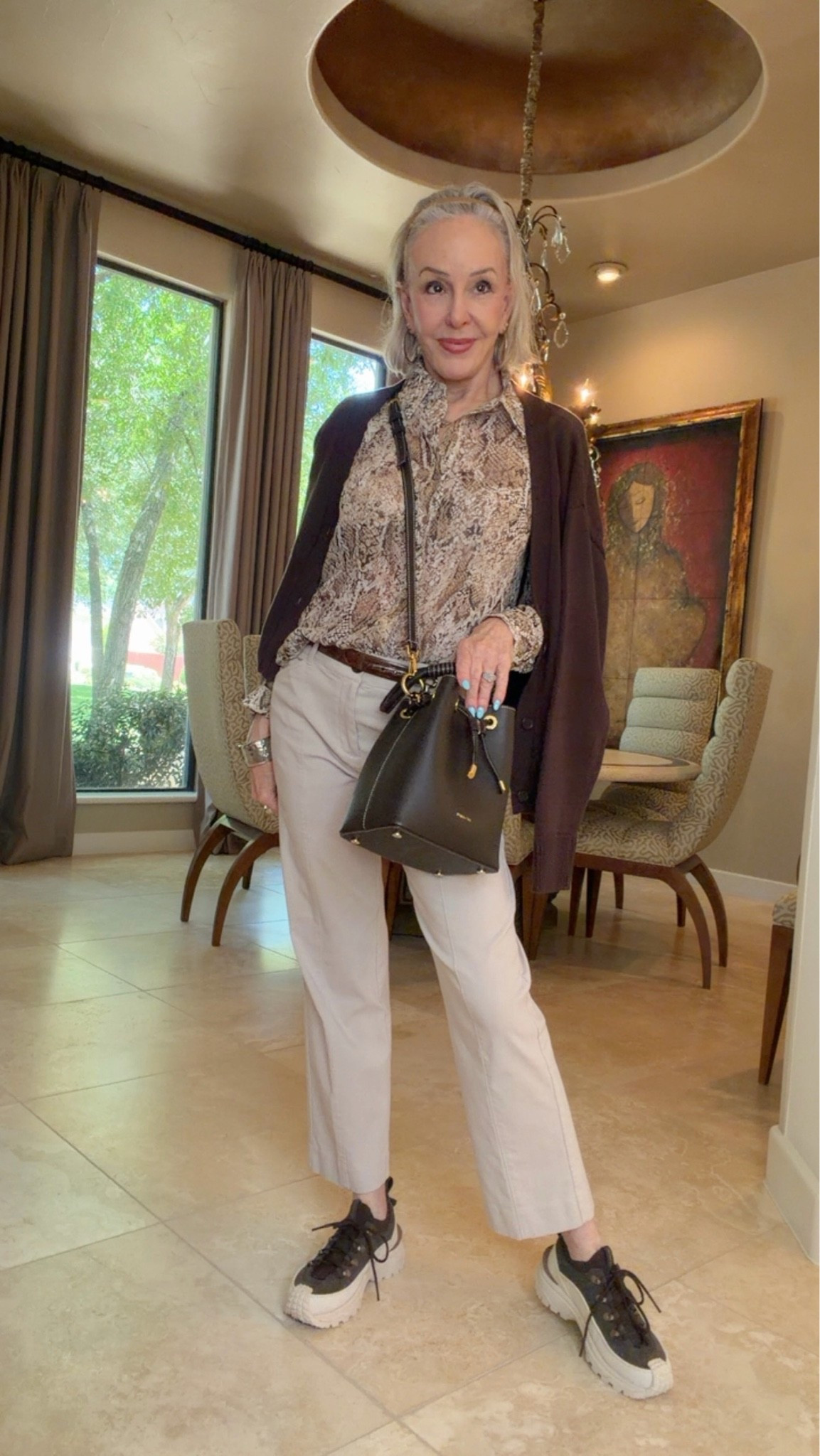 Chicos on trend….python print Georgette shirt. Emme khaki pants have great stretch. 
Cardigan sweater handy to wear year round. Comes in other colors.

#LTKOver40 #LTKWorkwear #LTKSaleAlert