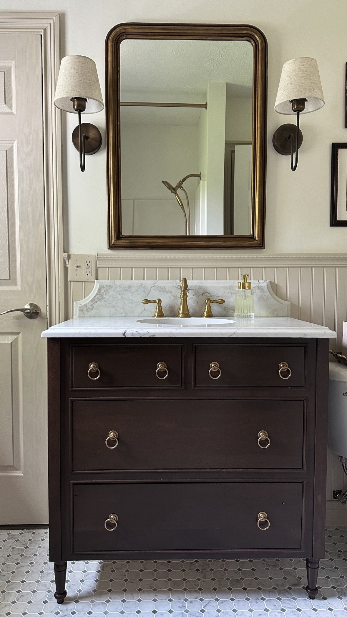 Guest bathroom renovation reveal! 🤎

Bathroom inspo, vintage bathroom, cottage bathroom, bathroom diy, bathroom accessories, bathroom vanity, bathroom sconces, beadboard 

#LTKHome #LTKStyleTip