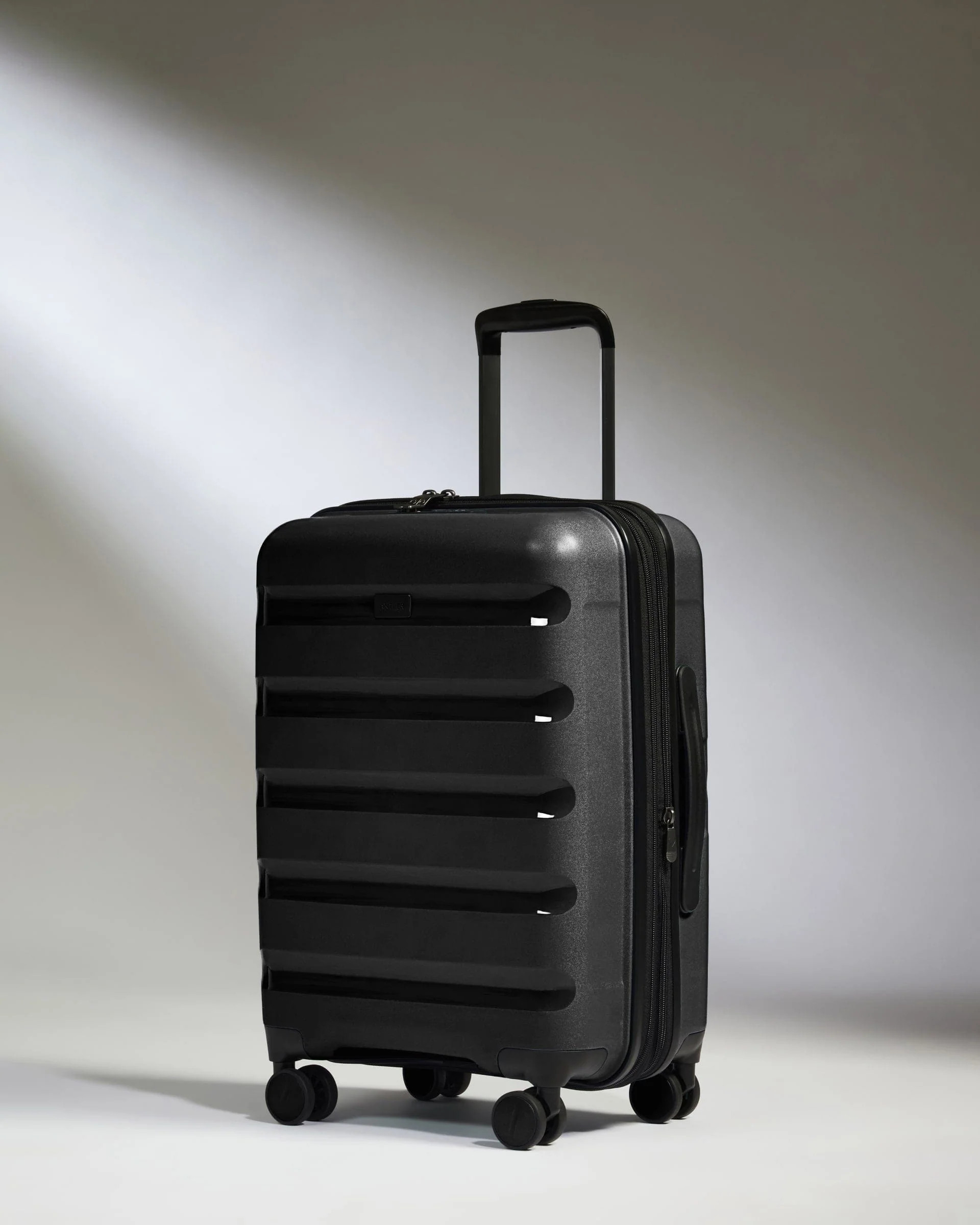 Expandable Cabin Suitcase Black - Logo Stripe | Lightweight Hard Shell Luggage | Antler UK