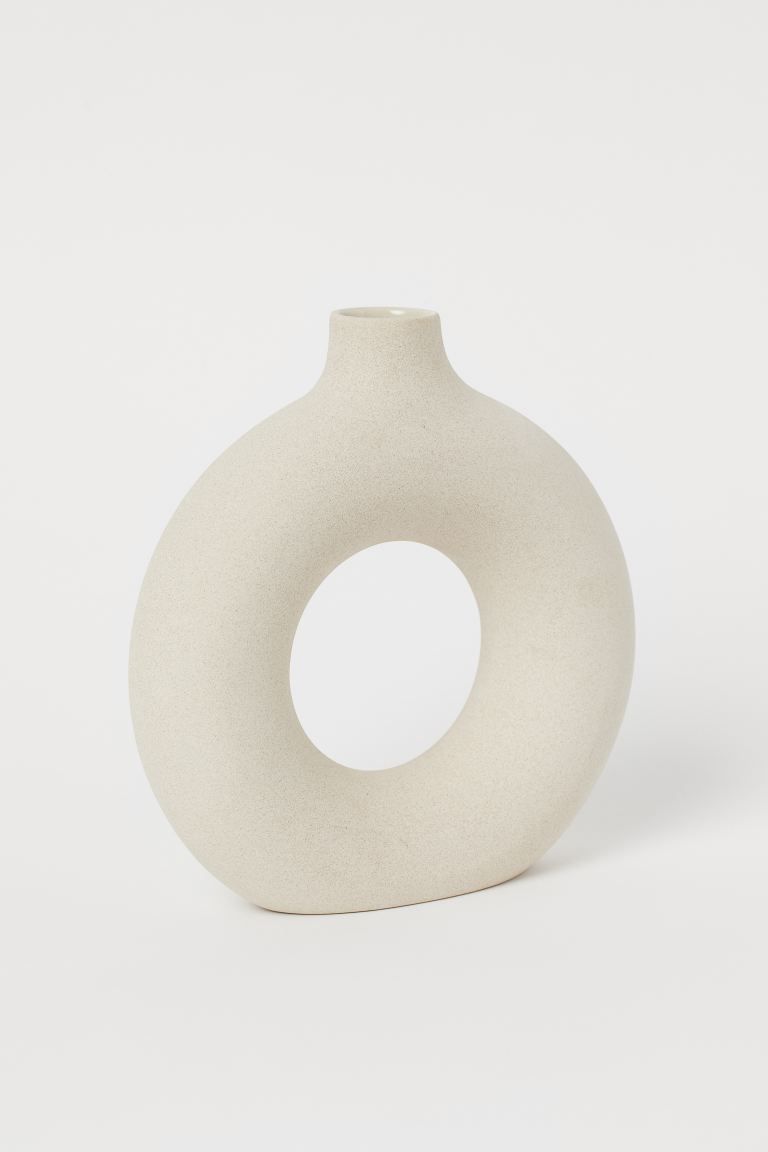 Circular ceramic vase. Diameter 7 3/4 in., total height 8 1/4 in. Diameter of opening approx. 1 1... | H&M (US + CA)