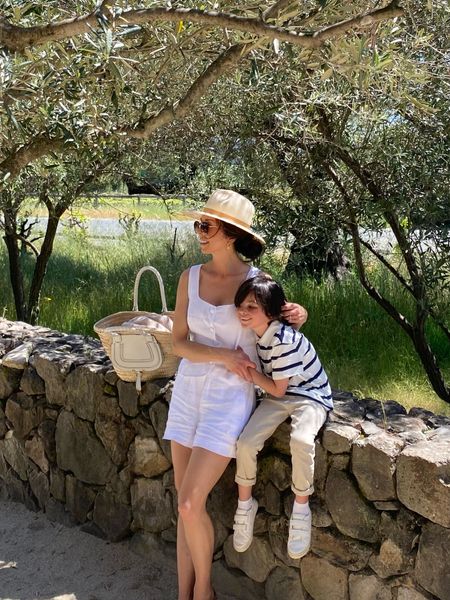 Sonoma with my family today. 
I’m wearing a white linen vest with matching linen pull on shorts. I’m wearing a 2 in the vest and XS shorts. They are so comfortable and perfect for warm weather.

Janessa Leone packable sun hat. I’m wearing a medium

Little boys navy and white striped cotton polo shirt.

Little boys white sneakers.

Travel outfit 
White shorts
White vest 

#LTKover40 #LTKfamily #LTKtravel