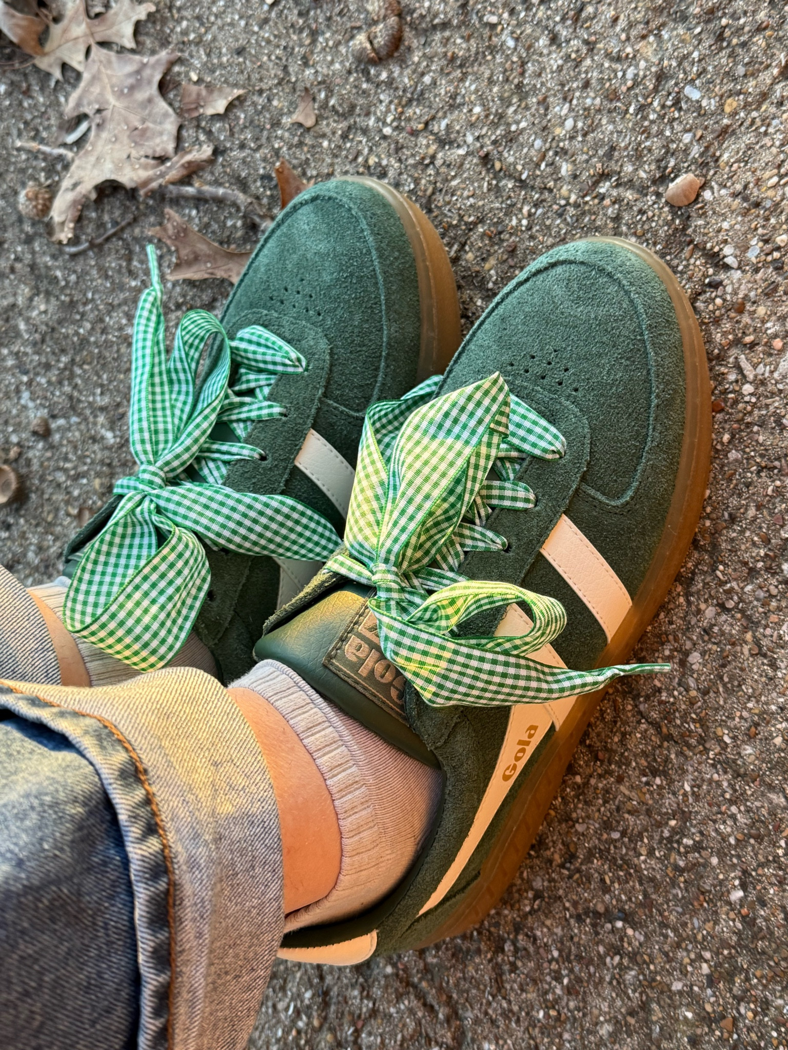 Women’s green gola sneakers from buckle 
Anthropologie checkered laces 

#LTKShoeCrush