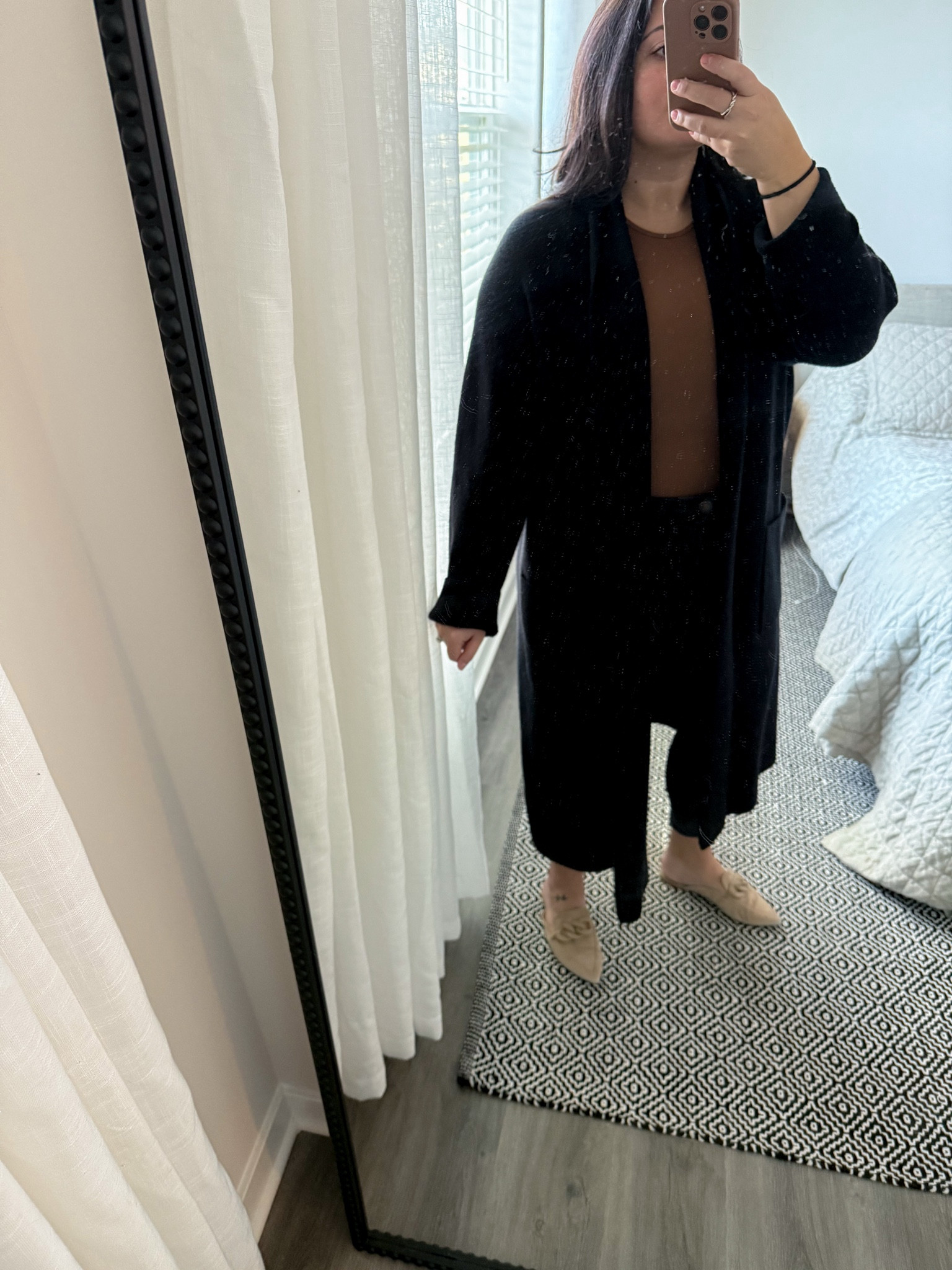 One of my favorite outfit combinations — black skinny pants, high neck body suit, mules and a cardigan 

This cardigan is from Jane & Mercer a few years back but linked a similarly luxurious one from Quince

Shoes size 8 tts
Pants size 8 runs big 
Bodysuit size M runs big 

#LTKWorkwear #LTKMidsize #LTKShoeCrush