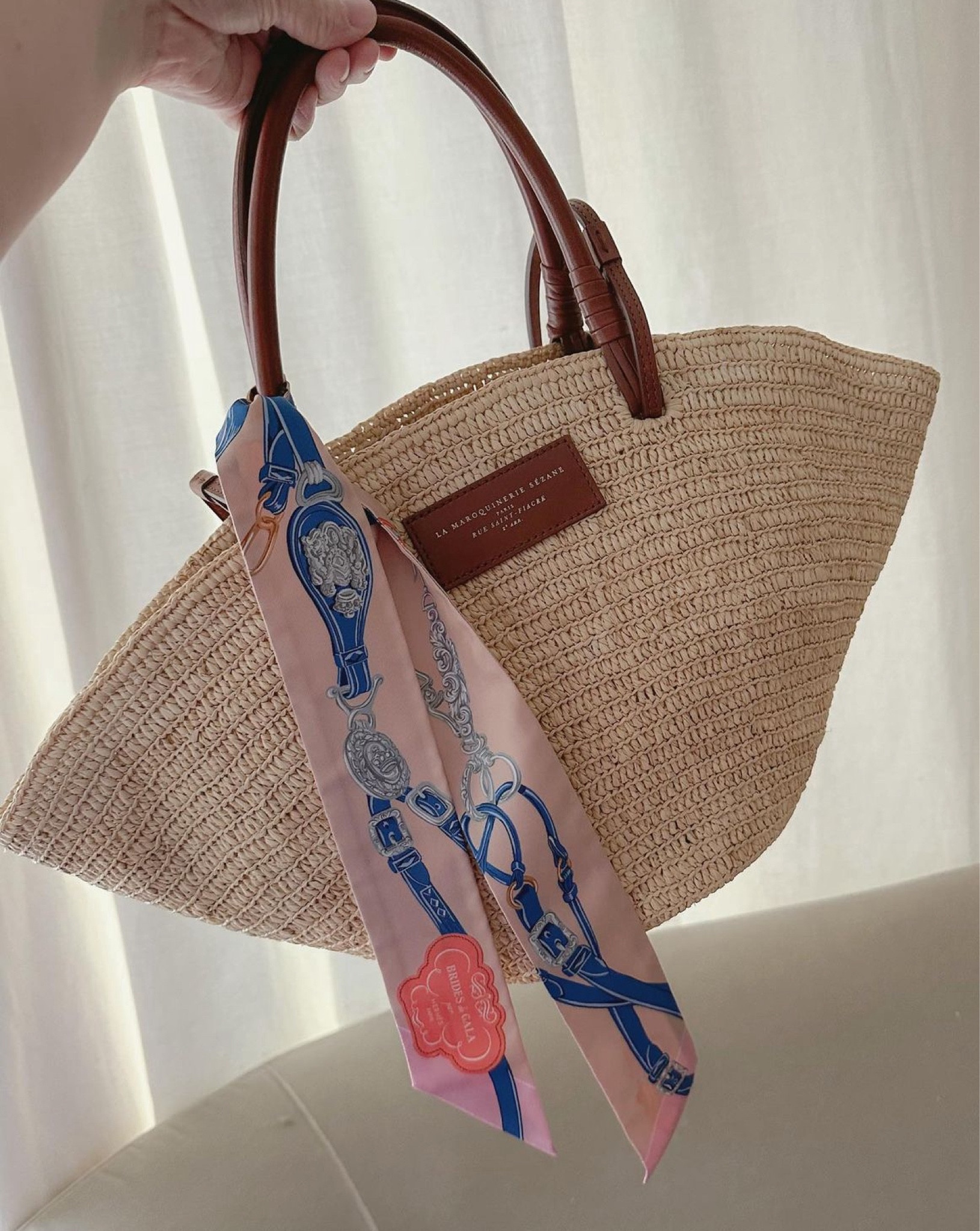 I put a little Hermès twilly on my Sézane raffia bucket bag to bring some more colour 🩷☺️ Perfect for summer and a day at the beach!

#LTKTravel #LTKItBag #LTKSeasonal