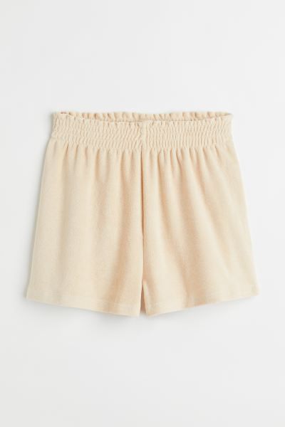 Soft terry shorts in a relaxed fit. High waist with covered elastication and a small frill at the... | H&M (US + CA)