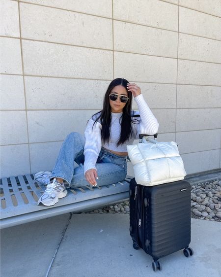 Travel outfit idea 
Skims tee: small 
American Eagle baggy jeans: 4 short 
Cardigan: one size 
Aviator sunglasses 
Puffer tote 
Hard shell carry on luggage 

#LTKSeasonal #LTKfindsunder100 #LTKstyletip