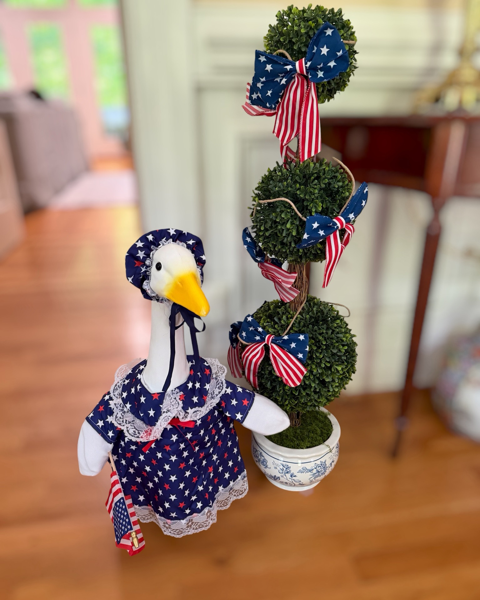 Patriotic Goose Decor & Grandmillennial Summer Touches 🇺🇸🪿🎀

My patriotic goose is officially dressed for summer 🇺🇸🪿✨ Added the sweetest star-spangled outfit, Americana bows, and grandmillennial decor touches to this little corner of the house. The chinoiserie planter, faux topiary, and patriotic ribbon details make everything feel extra festive for Memorial Day and the 4th of July ❤️💙🤍

Linking the goose outfit, patriotic bows, faux topiary trees, and decor pieces I used to create this fun Americana setup!

patriotic decor, patriotic goose outfit, grandmillennial decor, Americana home decor, 4th of July decorations, chinoiserie decor, faux topiary, summer home styling, patriotic bows, preppy home decor, festive holiday decor, Walmart home finds, Amazon home finds 🇺🇸

#LTKSeasonal #LTKHome #LTKmomlife