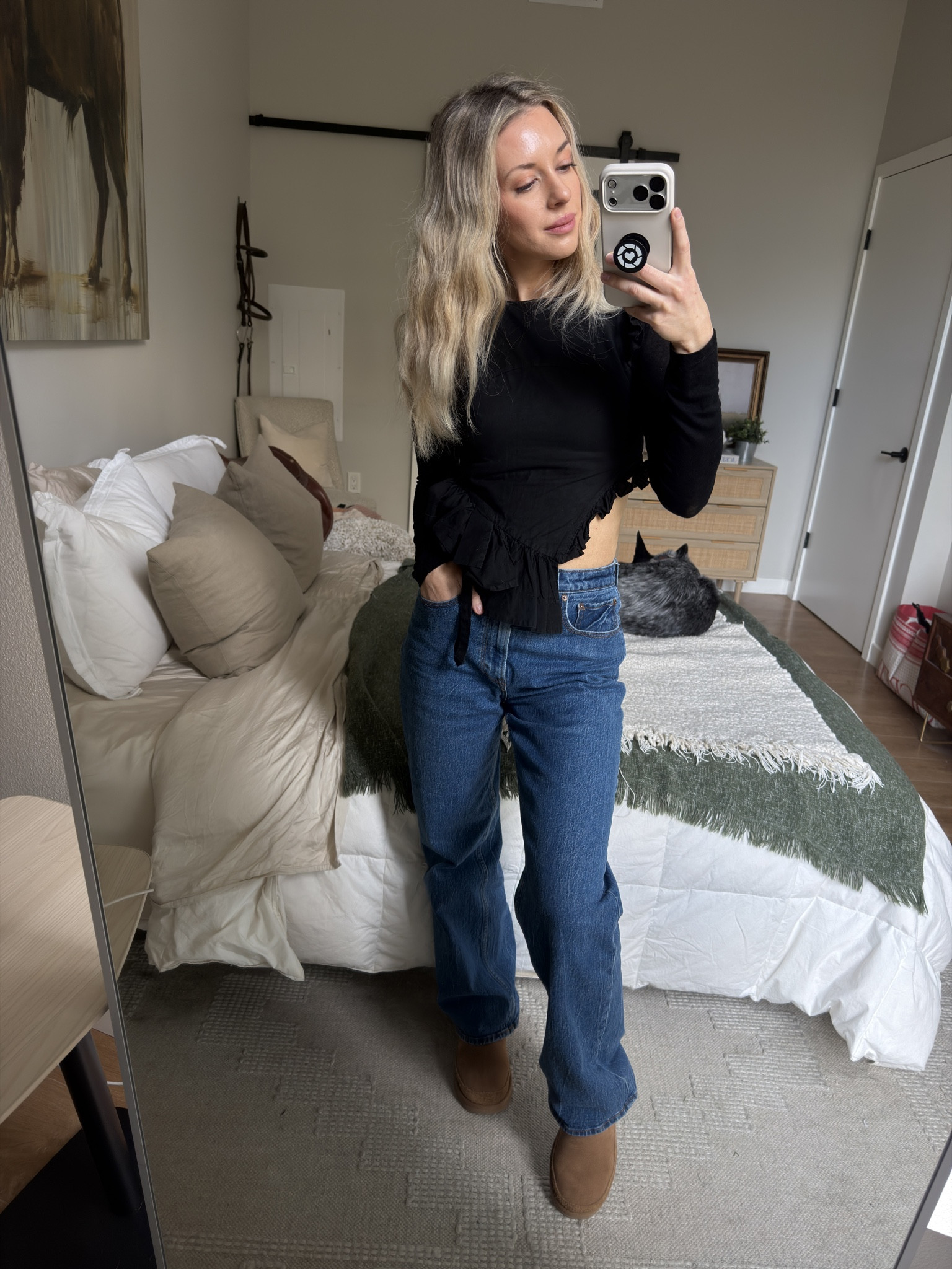 Fitted black ruffle cut out top, vintage feel denim, soft waves and uggs. My love language. 

#LTKootd