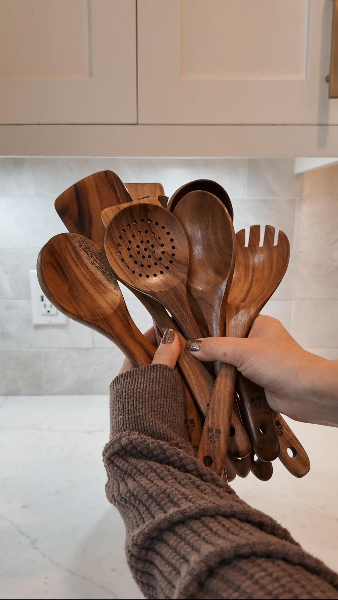 I ditched my old cooking utensils for a healthier, non-toxic option. This 10 piece teak wood utensil set is not only beautiful but functional in your kitchen. They look great in this marble crock on my kitchen countertop.

#LTKHome #LTKSaleAlert #LTKfoodie