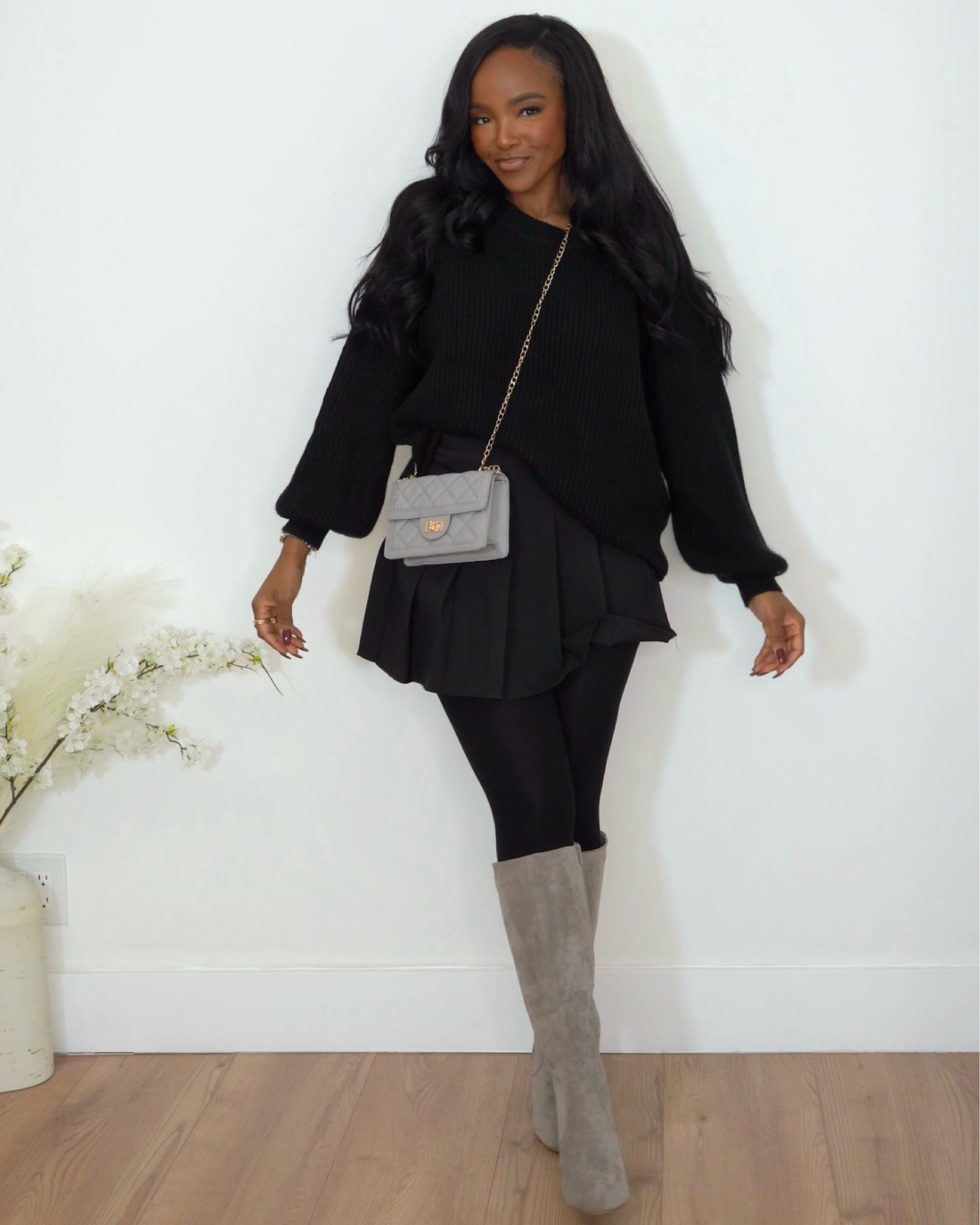 Cute way to style a tennis skirt for winter ! Loving this grey vibe with black. Added tights for warmth bag match perfectly with the boots and the boots have very minimal heel 

|•Size small I’m 5’4 | 140lbs | 36D -27 -40  IG & YT: kirasfashionfinds TT: kiraabboud•|