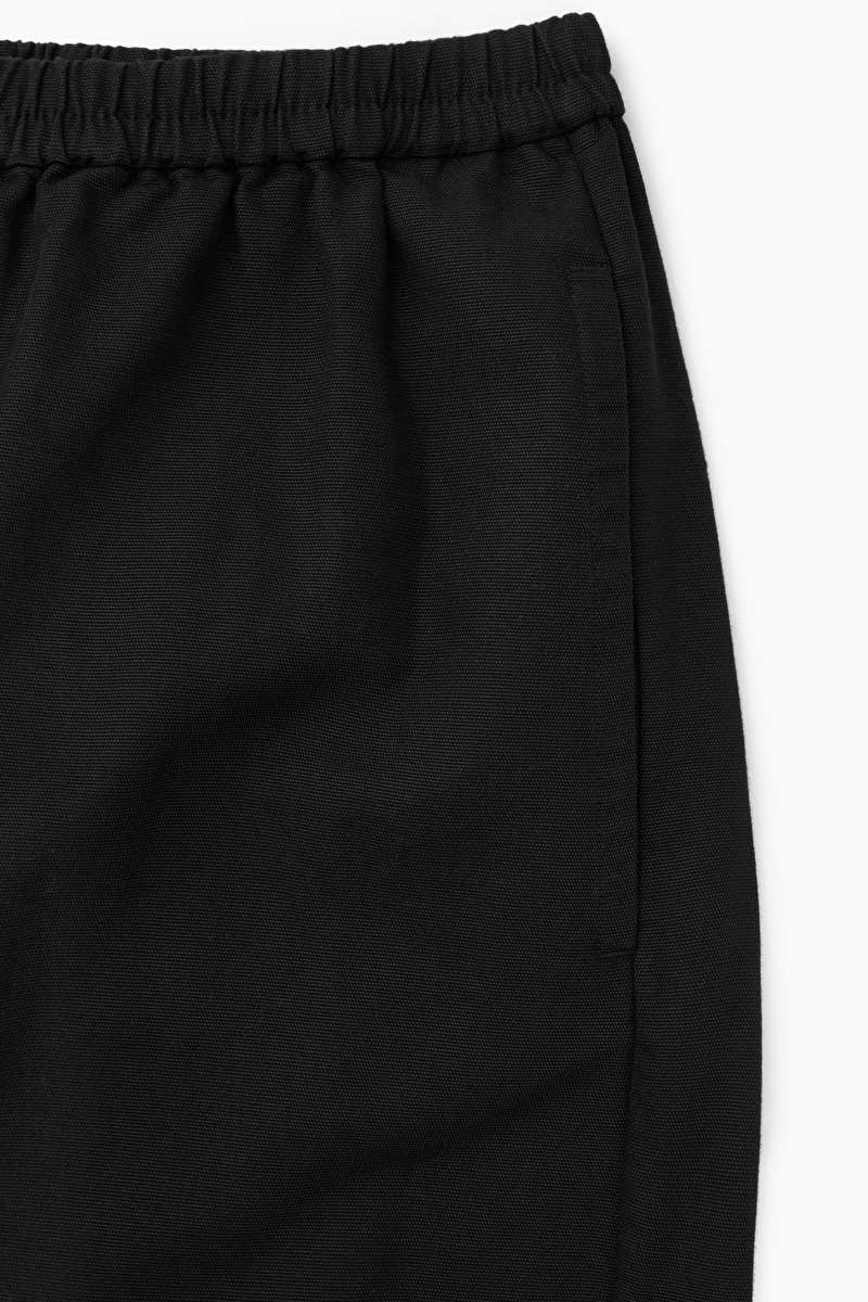 HomeTrousers ELASTICATED BARREL-LEG TROUSERS | COS UK