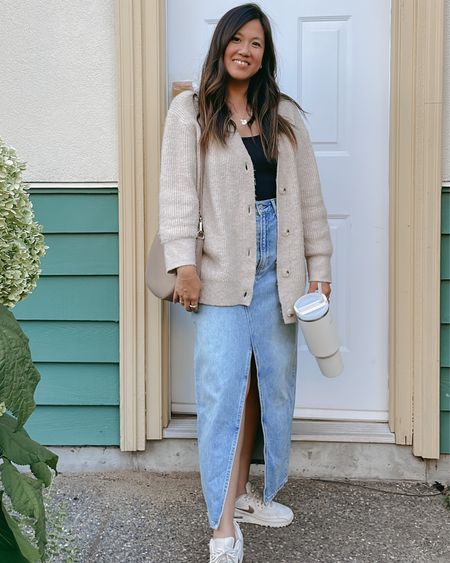 loving the maxi Jean skirt and finally found one I like — here’s an easy transitional outfit even tho it’s really not transitional weather but it does cool down at night !! #maxijeanskirt 

5’4 and hits right at the ankle. Aritizia denim forum size 29, but linked similar! Bodysuit size M from H&M. 

#LTKstyletip #LTKFind #LTKSeasonal