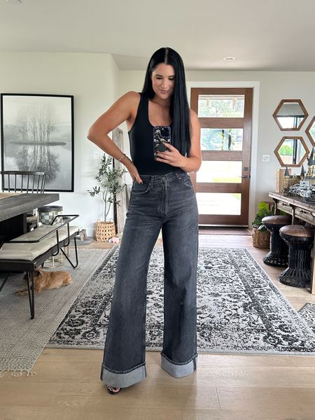 Nuuds is having a huge up to 60% off sale! My all-time favorite black bodysuit is only $40 from 48 and it comes in 10 different colors. I am wearing the size medium. Works great if you have a long torso as well.

These wide leg jeans are from agolde and I am wearing the size 26.

#LTKStyleTip #LTKSaleAlert #LTKFindsUnder100