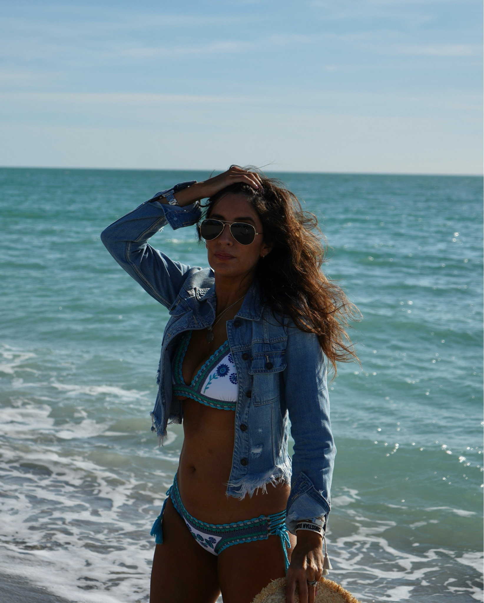Rocking my frayed Hidden Jeans jacket over a bikini with Ray-Ban aviators at the beach. 

#BeachReady #HiddenJeans #RayBanAviators #SummerFashion #ChicAndCasual #OOTD #BeachVibes #BikiniLook #FashionInspo #SunnyStyle

#LTKBeauty #LTKSwim #LTKStyleTip