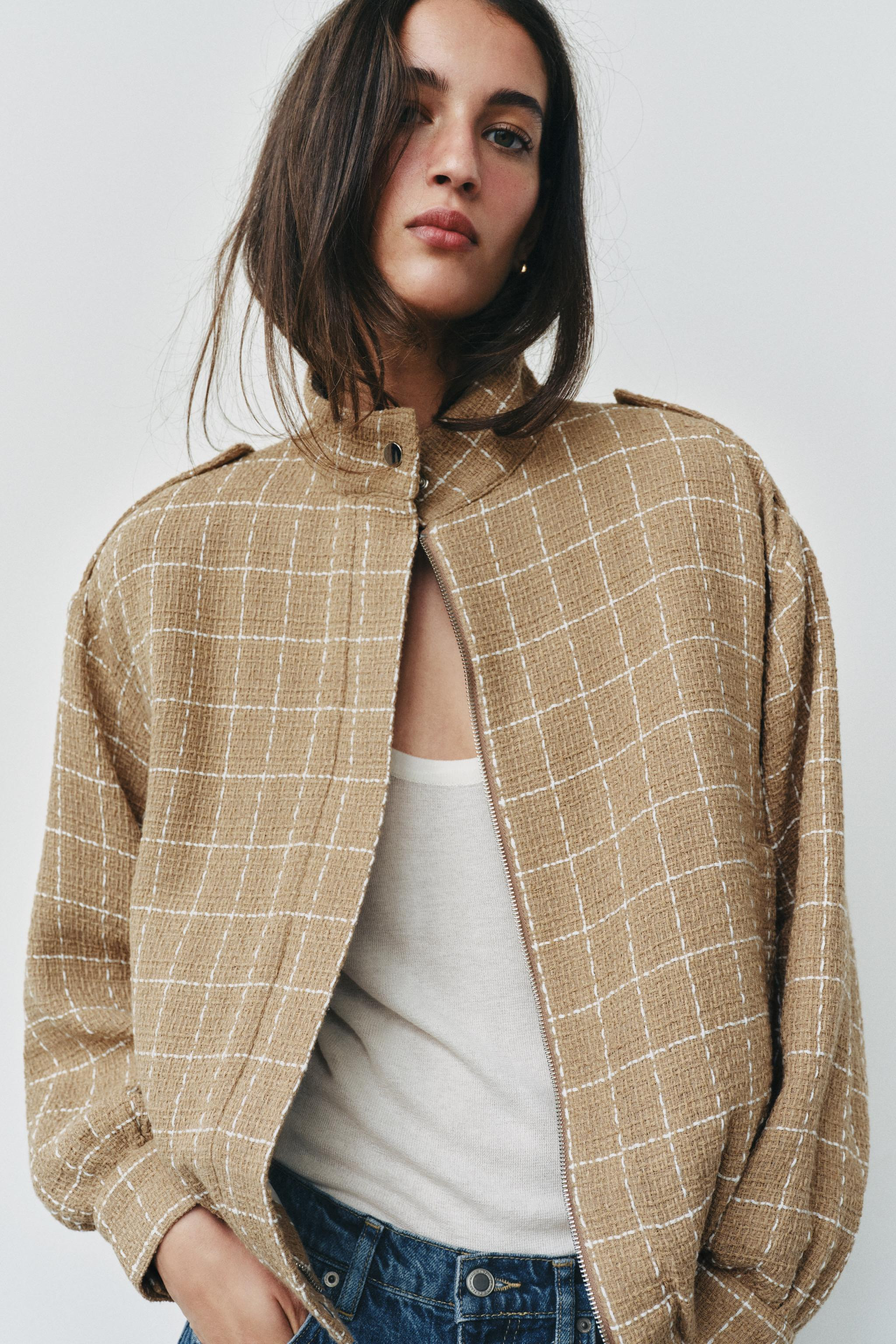 Bomber jacket with a high collar, long sleeves and shoulder tabs. Featuring front pockets, an ela... | Zara AU