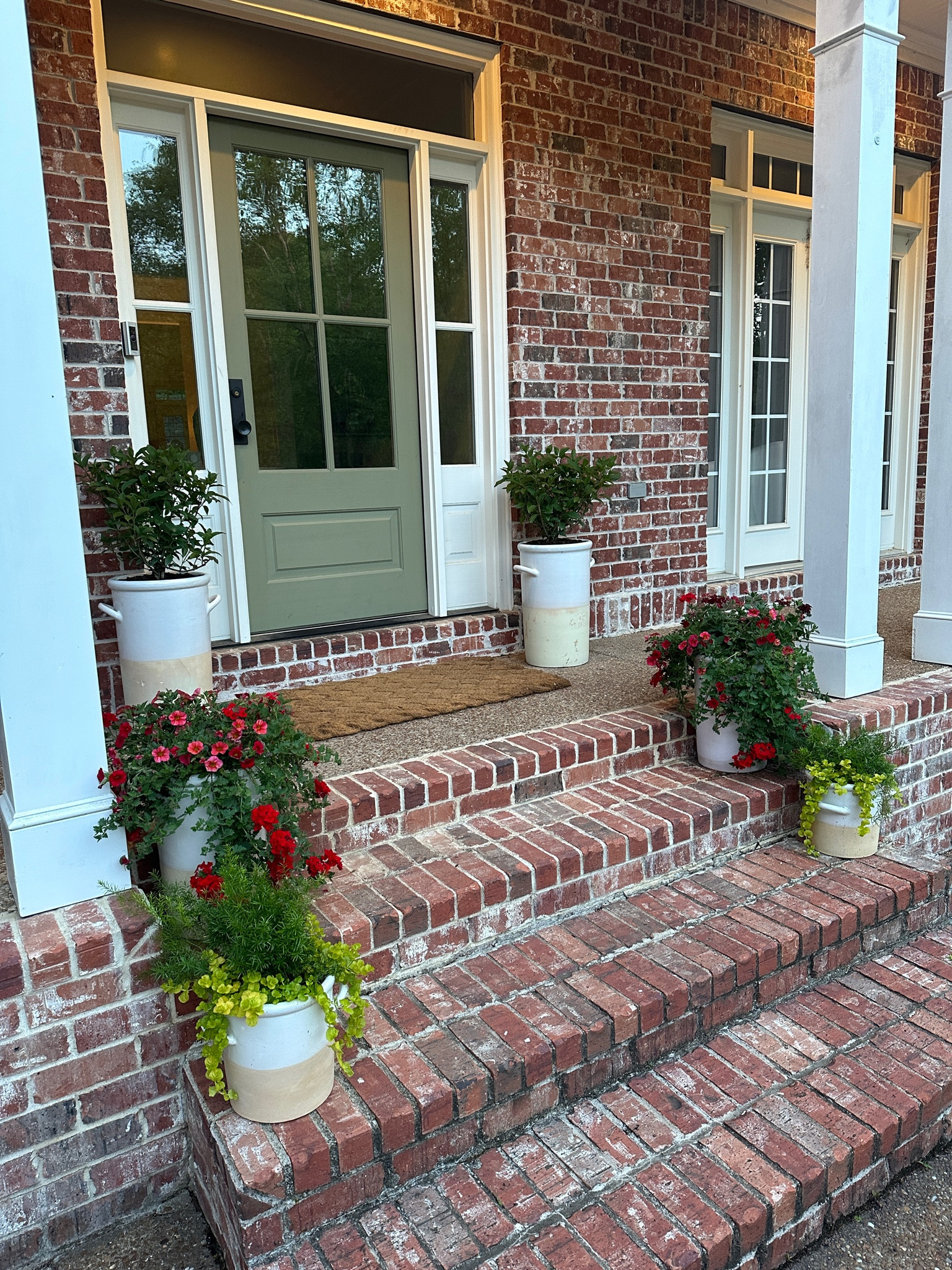 finally set up our front porch for spring! 🪴 

planters, outdoor space, front door paint color 

#LTKSeasonal