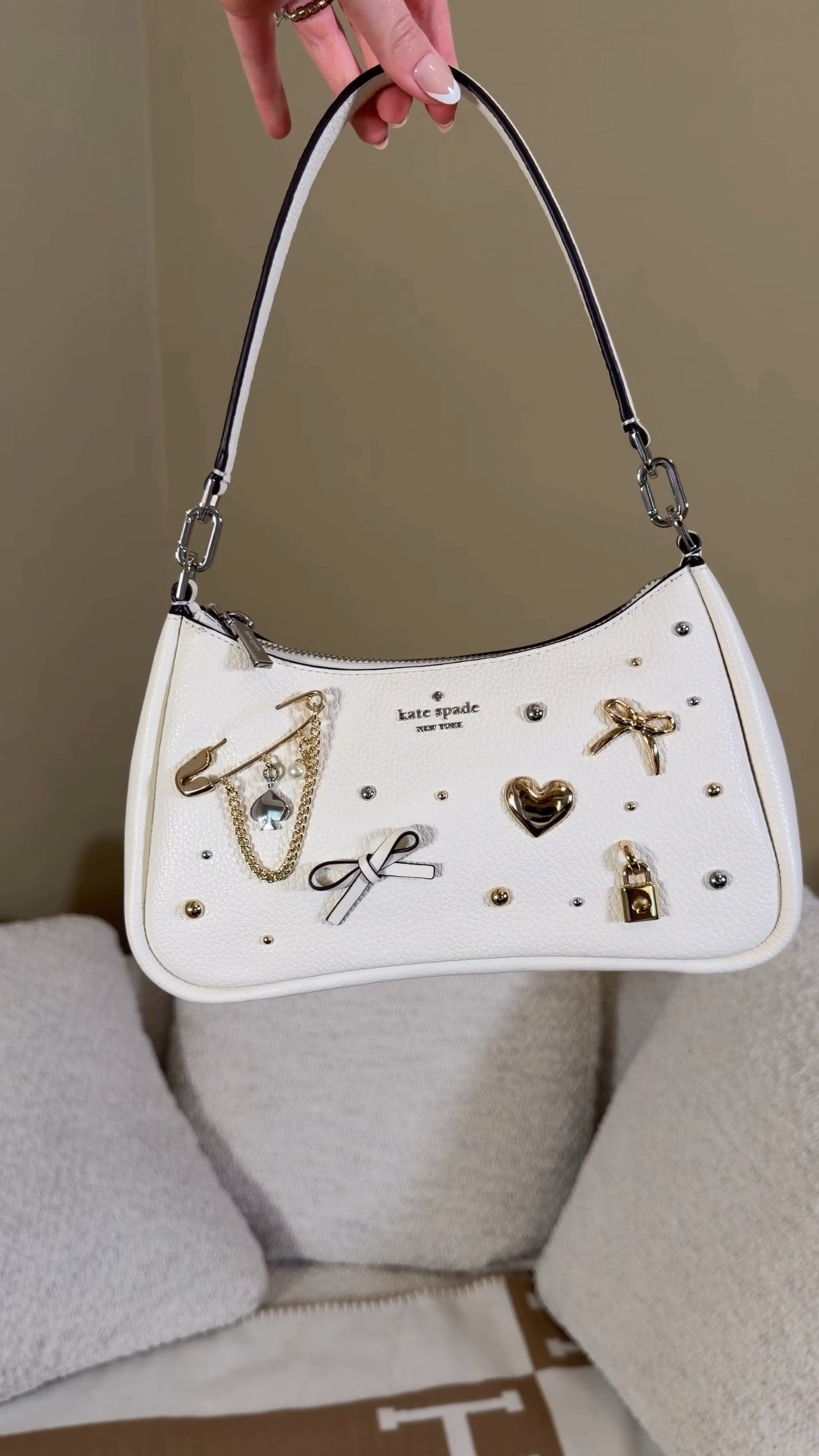 I’m calling it, this style is going to be the next big bag trend! 😍 Comment SHOP & I’ll dm you the link ♥️

Kate spade is having their fall sale and cute deals like 2 for $159 like this charmed Kayla bag and matching wallet!

As soon as I saw this little white bag I out all of her cute charms I knew I needed her 😍 I love that the charms are a mix of gold and silver since I love mixing metals in my jewelry and bags. I saw that coach is coming out with a similar charmed tabby so I’m thinking bags with a bunch of pins and charms are going to be big trends in the coming seasons and I’m so excited. 
This bag can be a shoulder bag or crossbody bag and I love that some do the charms move. Such a fun bag!